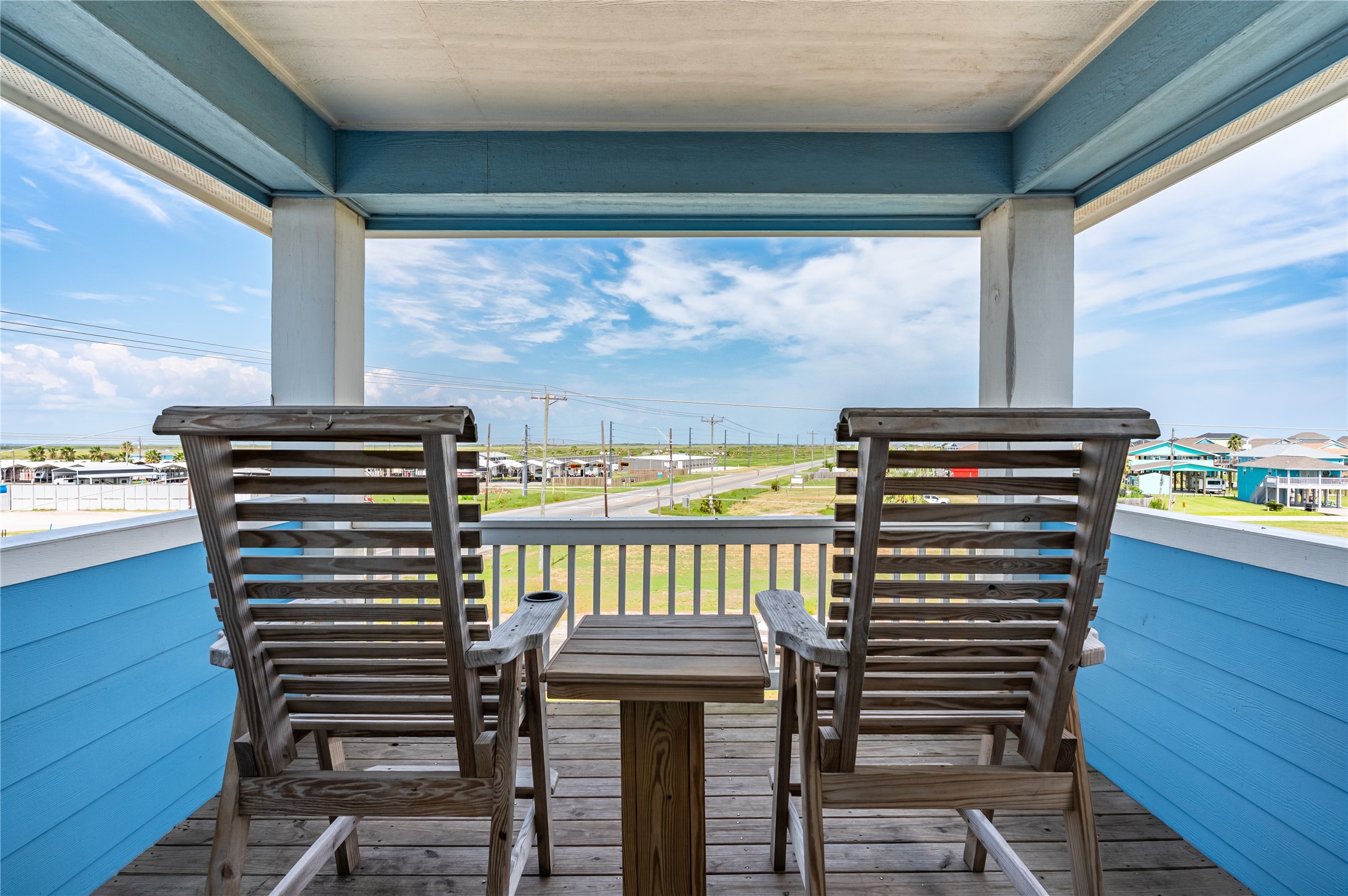 This tucked-away balcony becomes your favorite spot to slow down, settle into the rocking chairs, and enjoy the wide-open view.