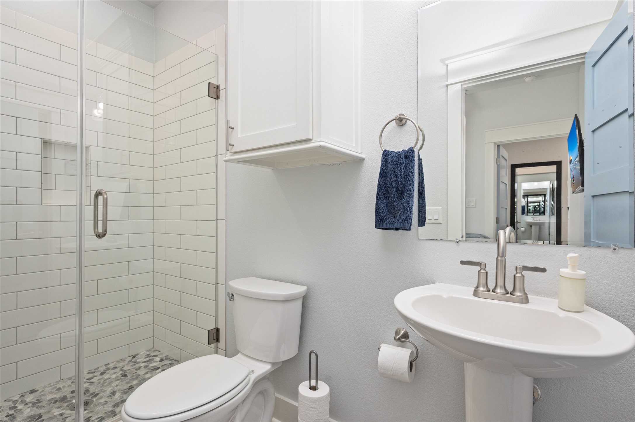 Start and end your day in a private bath with a glass-enclosed tiled shower and convenient built-in storage.