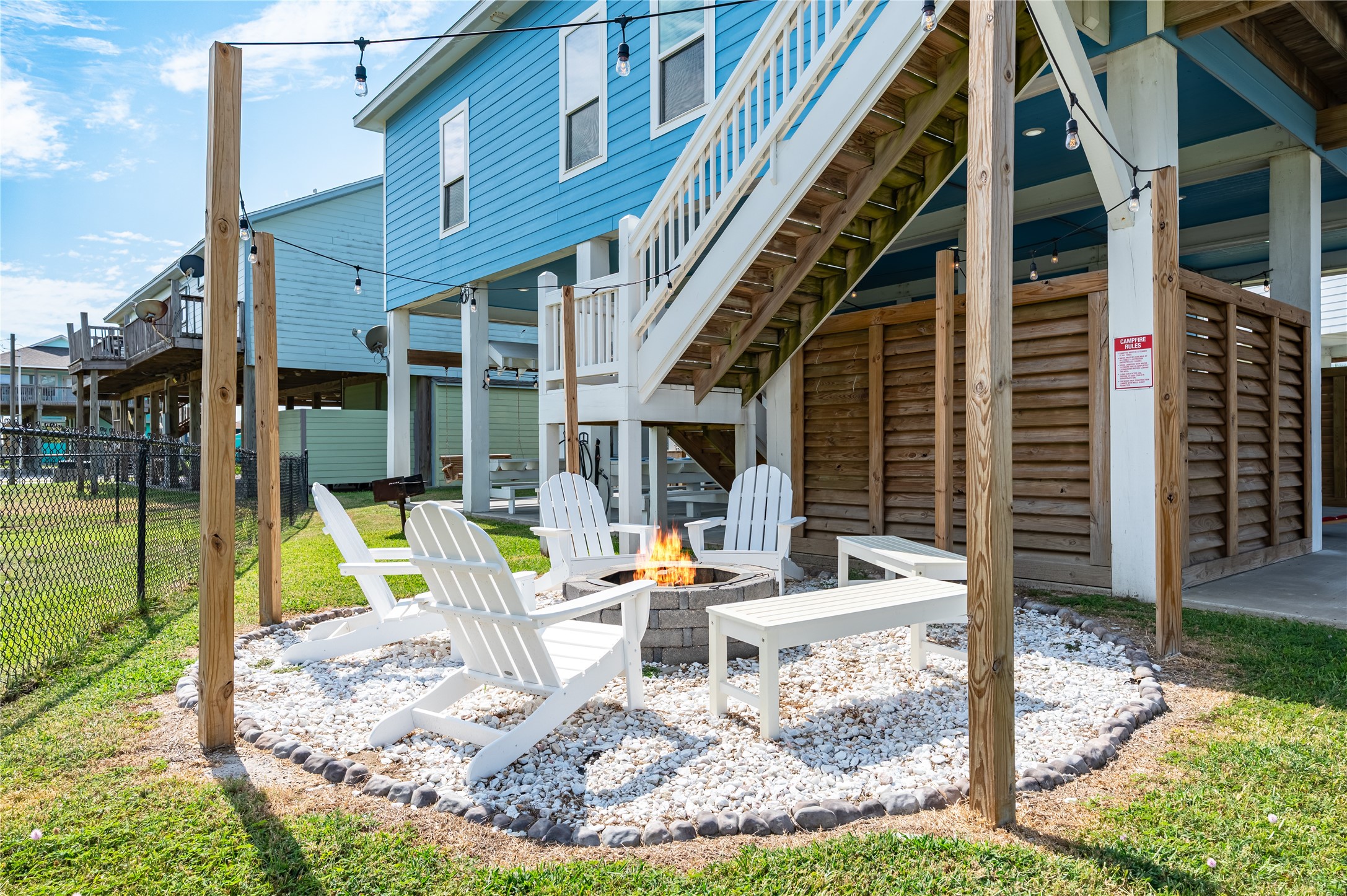Evenings wind down around your private fire pit, where Adirondack chairs and string lights create the perfect spot for stories, drinks, and good company.