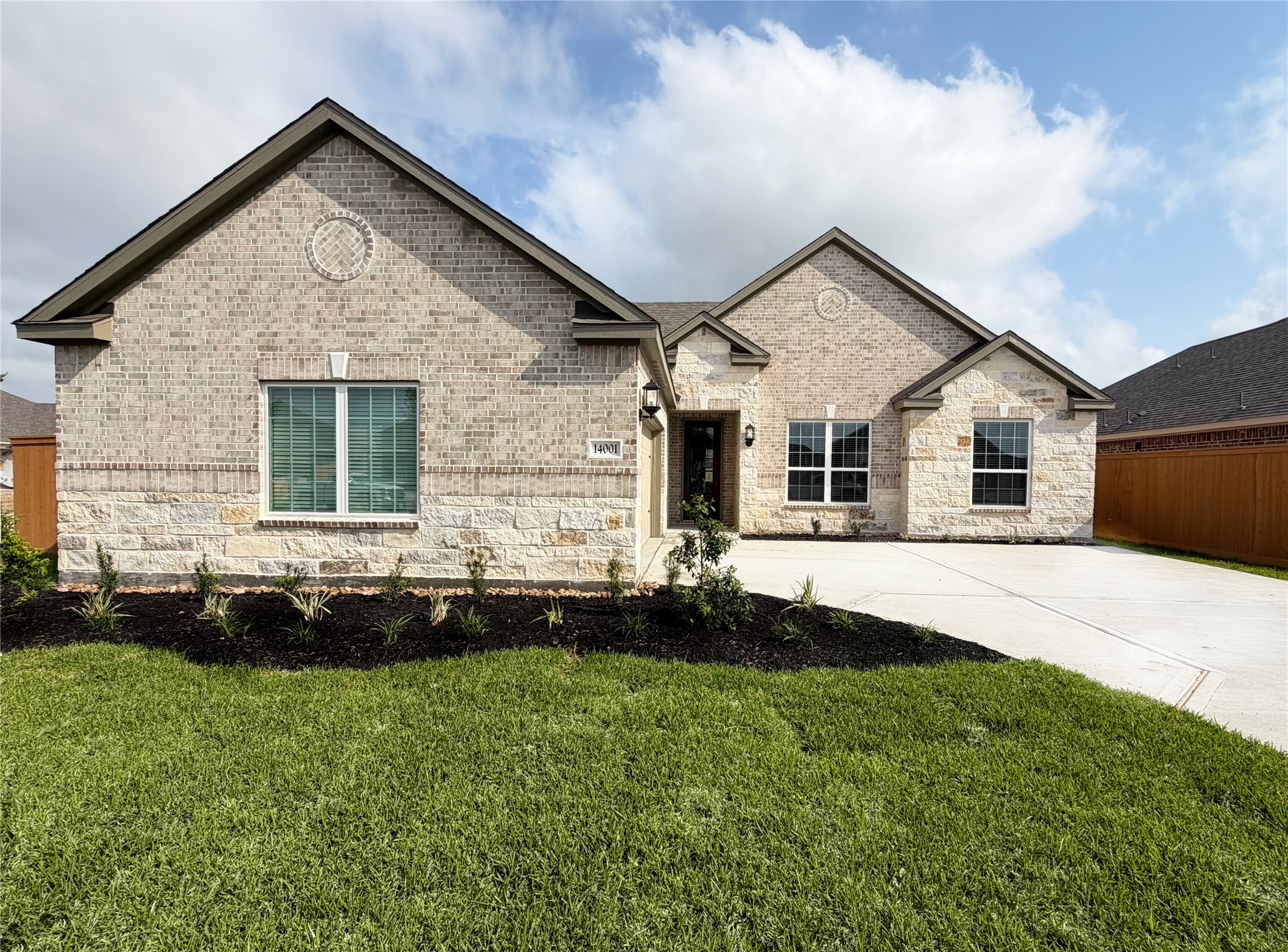 The Ironwood Plan by LGI Homes. Completed example being built at 14001 Starboard Reach Drive. Colors and Finishes may vary from completed example photos.