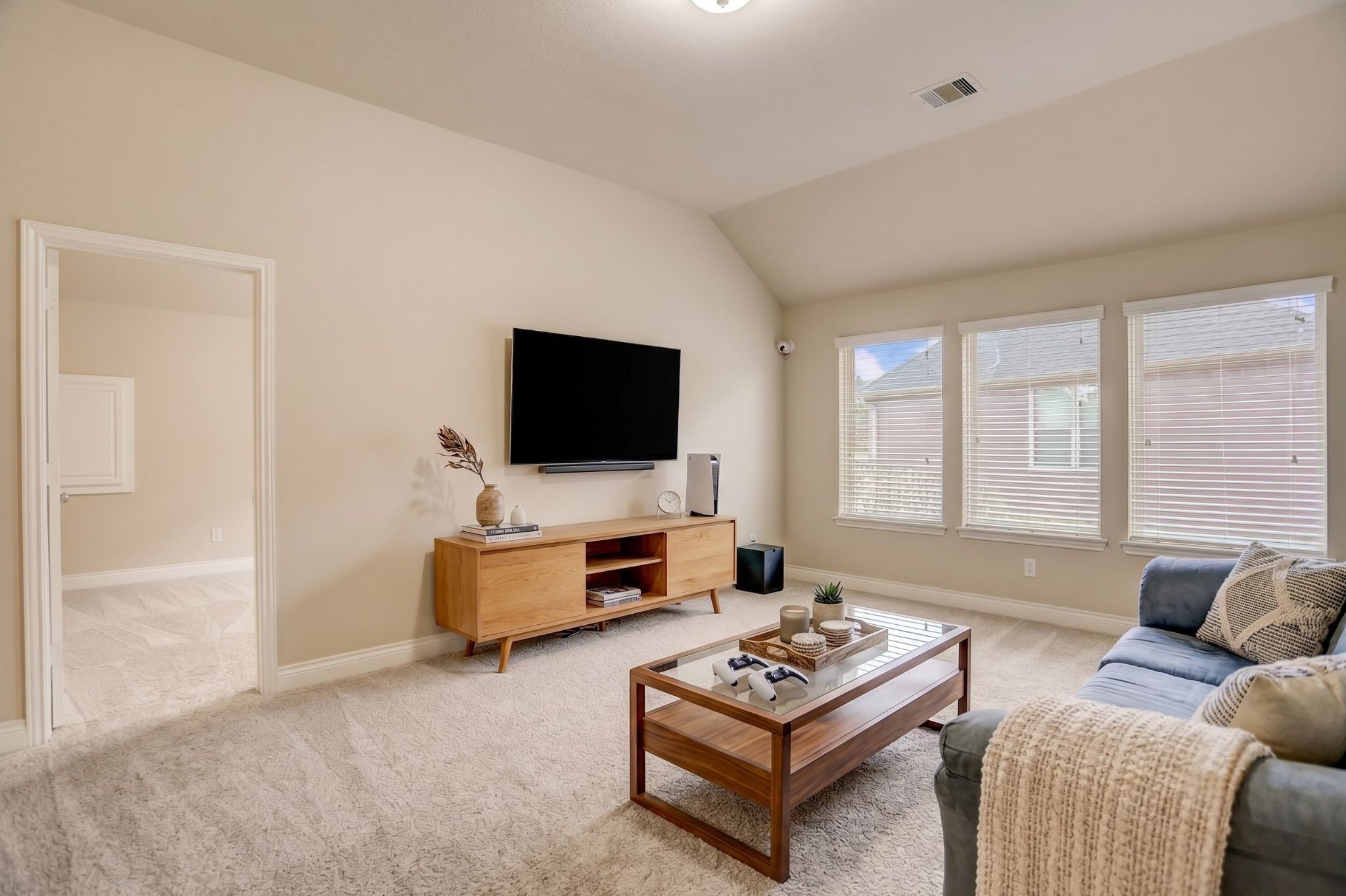 This versatile upstairs flex space has been virtually staged to highlight its endless possibilities. Whether you envision a game room, media lounge, playroom, fitness area, or teen retreat, this spacious room adapts to your lifestyle. Large windows fill the space with natural light, creating a bright and welcoming atmosphere that's perfect for relaxing, entertaining, or everyday living.