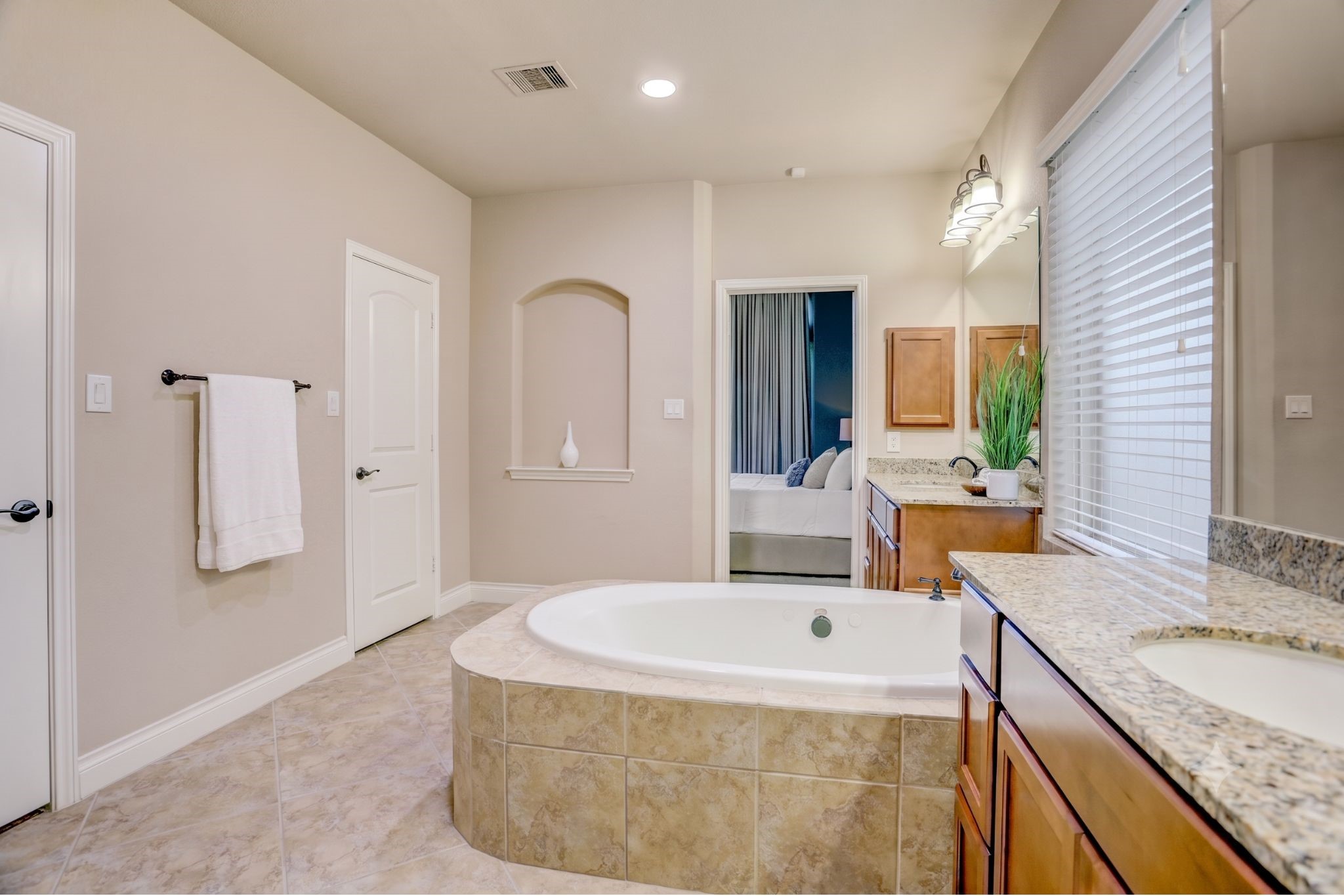 Designed for comfort and convenience, the expansive primary bathroom provides the space and amenities of a private retreat, making every day feel a little more luxurious.