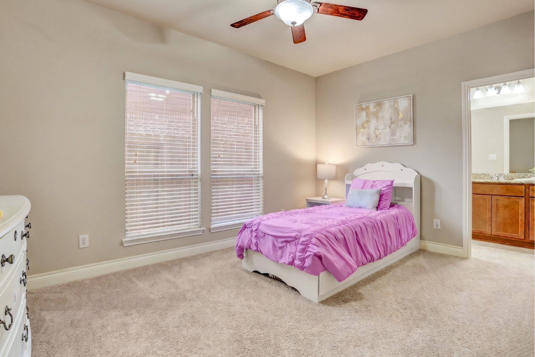 A spacious first floor secondary bedroom with an adjoining full bath provides the perfect retreat for guests, extended family, or multi-generational living while offering added privacy from the upstairs bedrooms.
