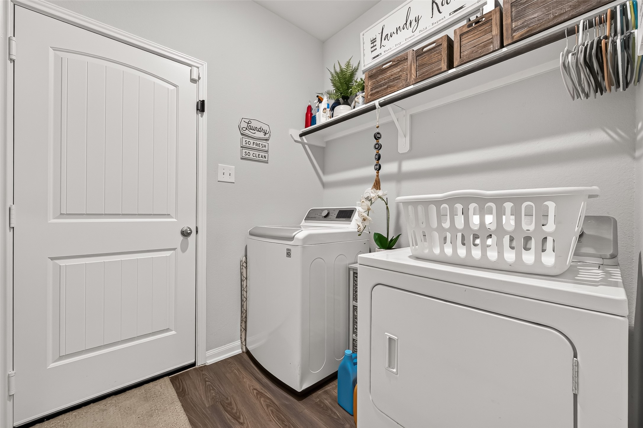 Efficient and stylish laundry room featuring modern appliances, ample shelving, and a bright, organized space for easy chores.