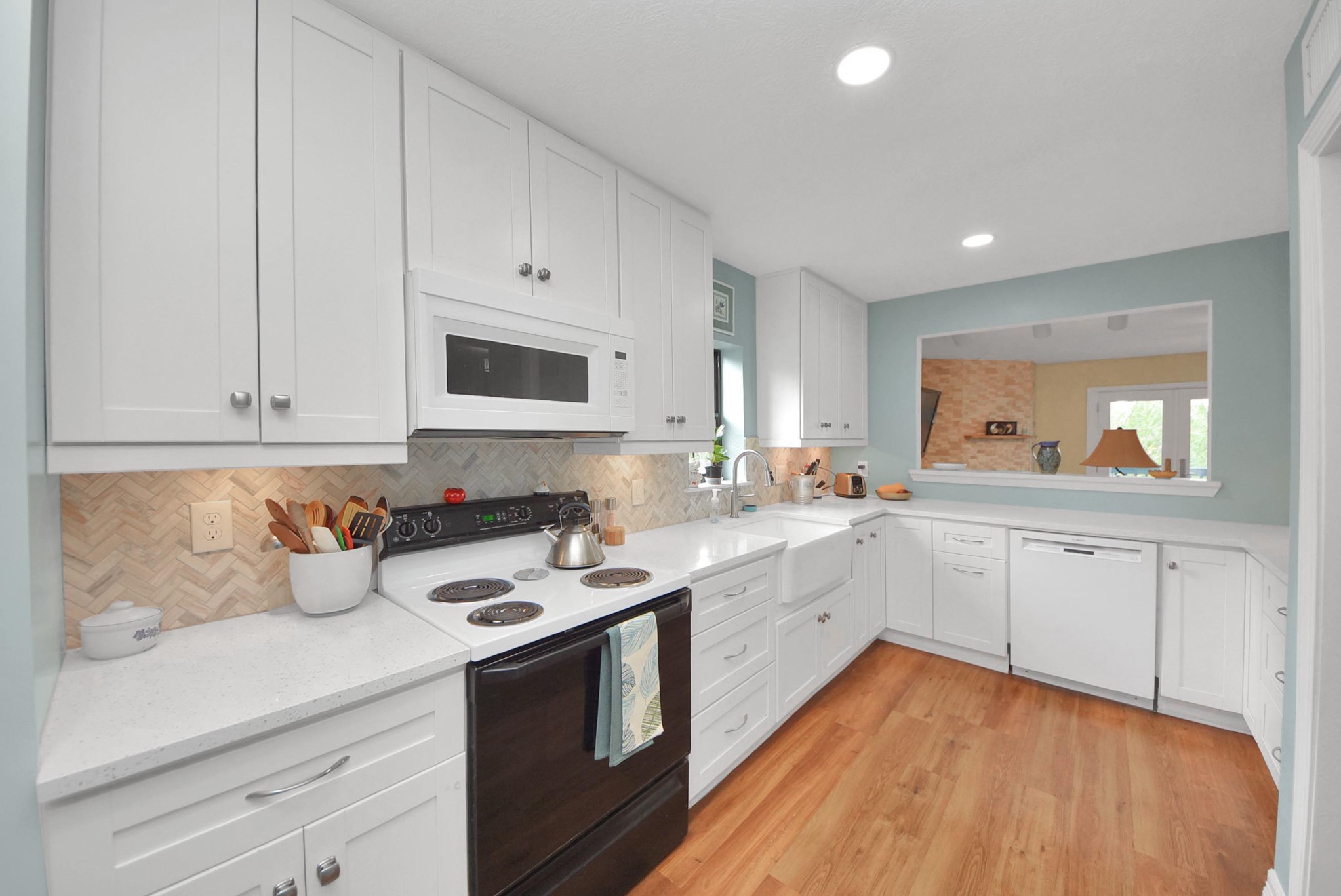 trendy white cabinets with pet resistant flooring