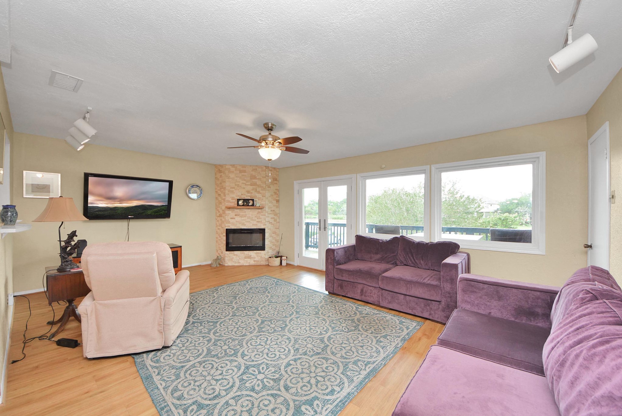 Living room with lots of natural light and walk out balcony