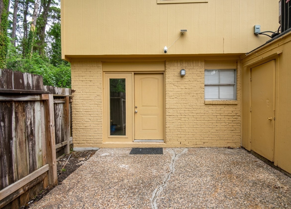 Outdoor living is easy with a private fenced patio that includes a handy storage closet.