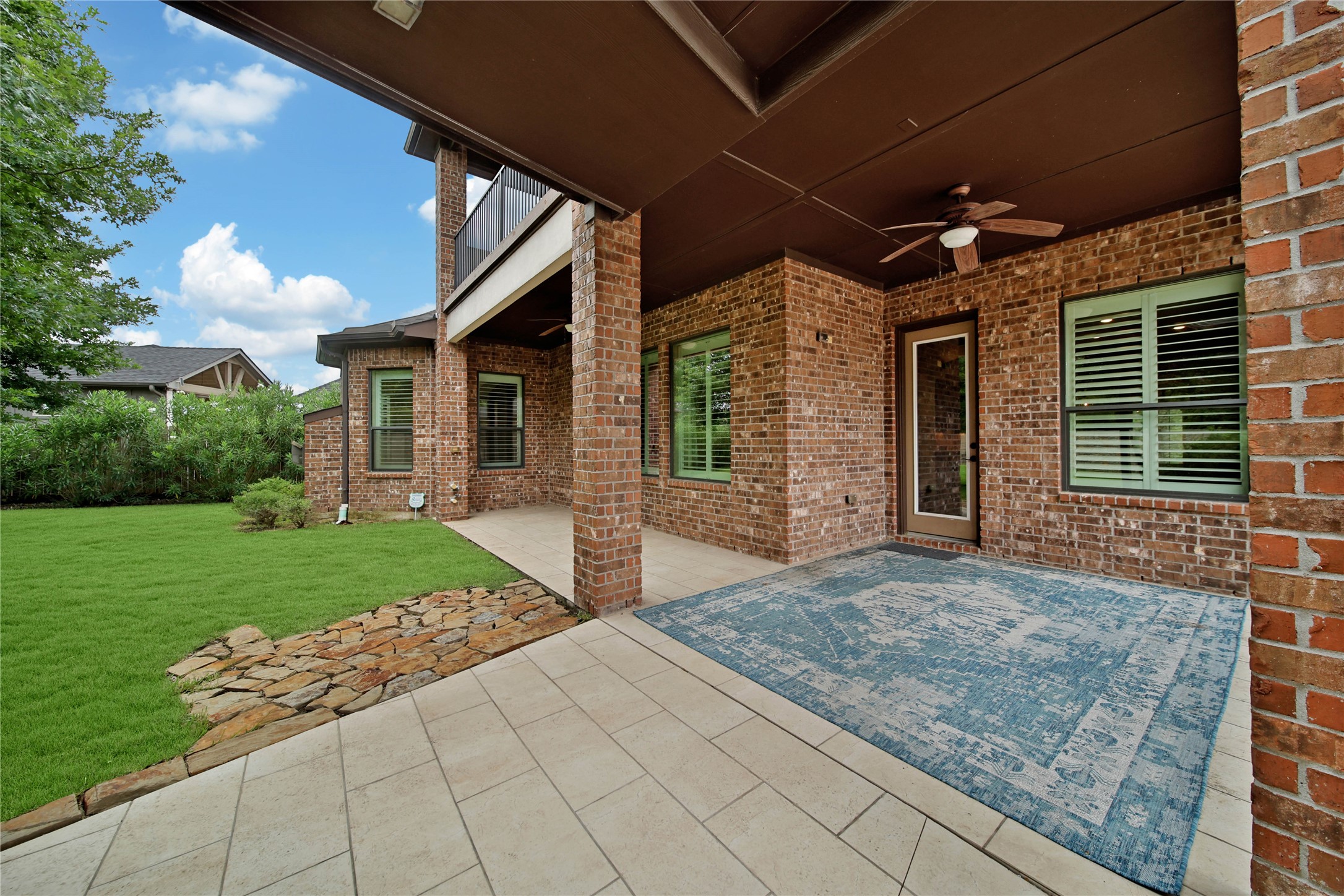 The oversized wrap-around covered patio offers endless possibilities, with gas and water stubs already in place for creating the outdoor kitchen of your dreams.