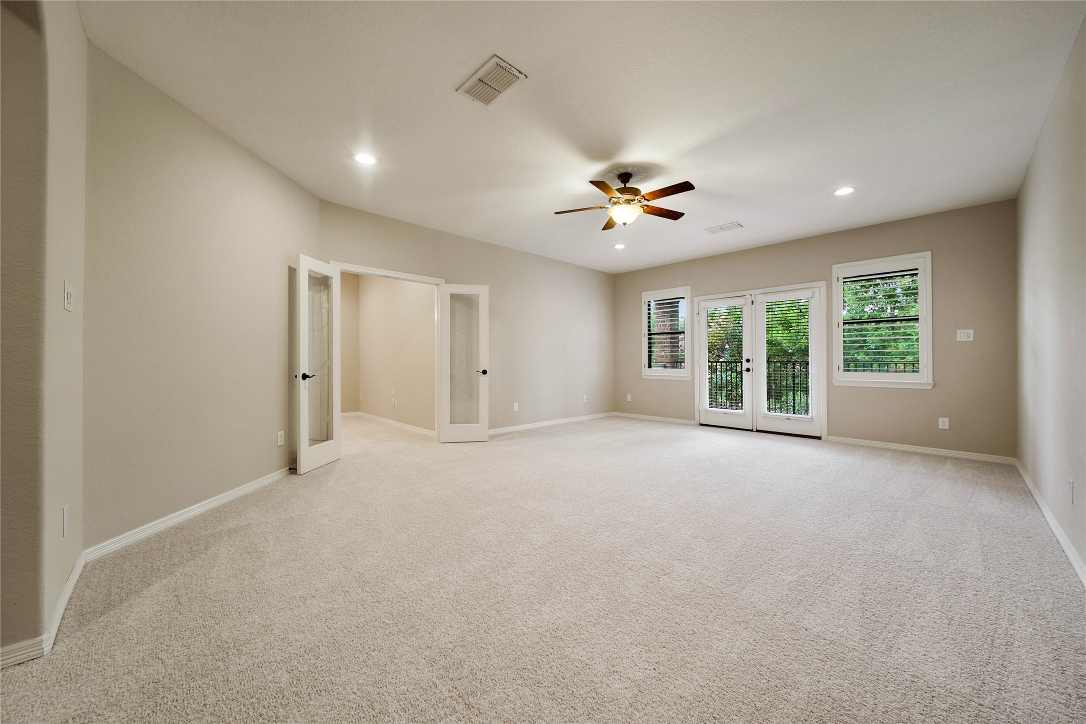 A private media room off the gameroom completes the upstairs entertainment area, offering a comfortable space designed for unforgettable movie nights and gatherings.