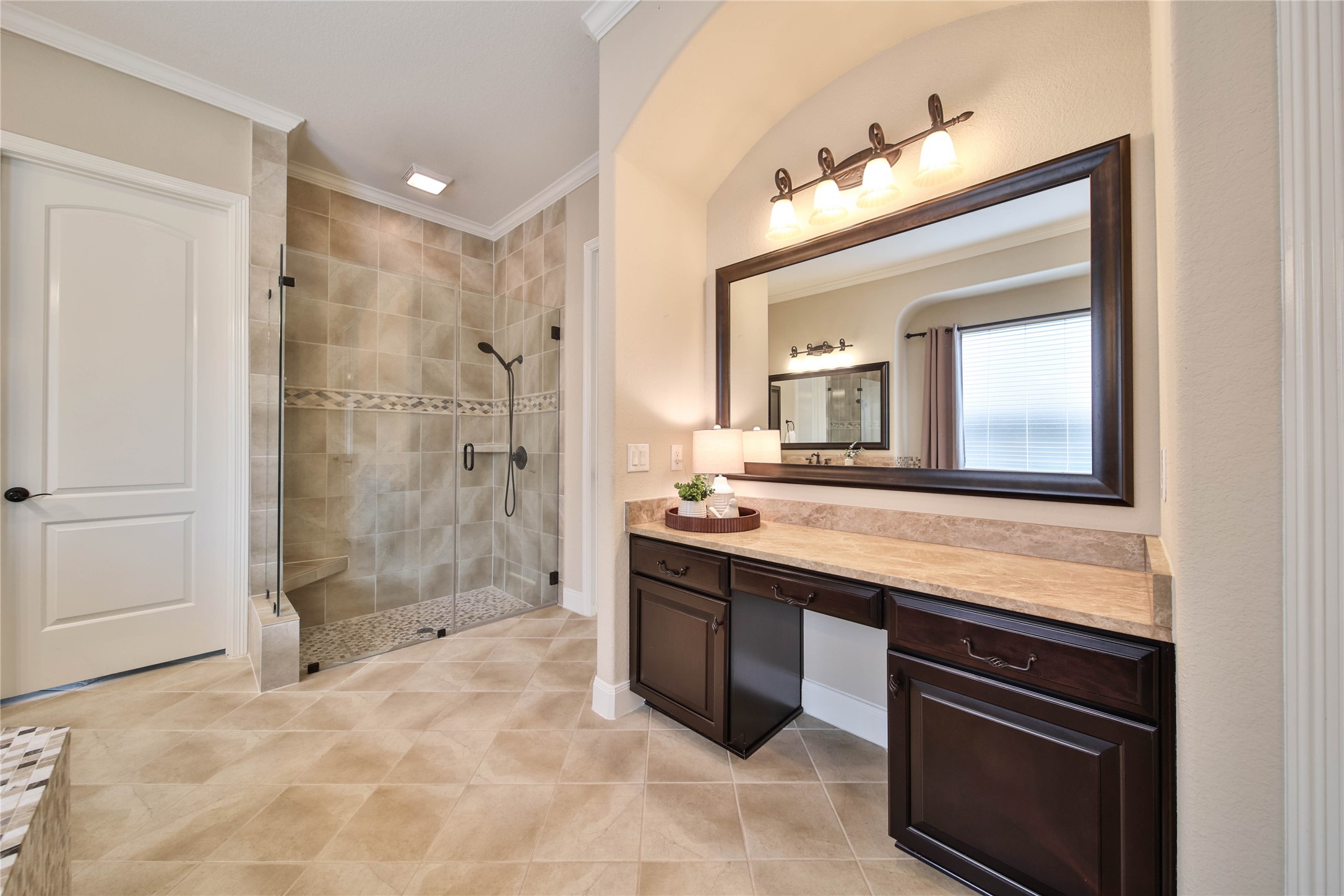 A dedicated vanity area provides the perfect spot to sit and get ready for the day ahead or prepare for a special evening out.