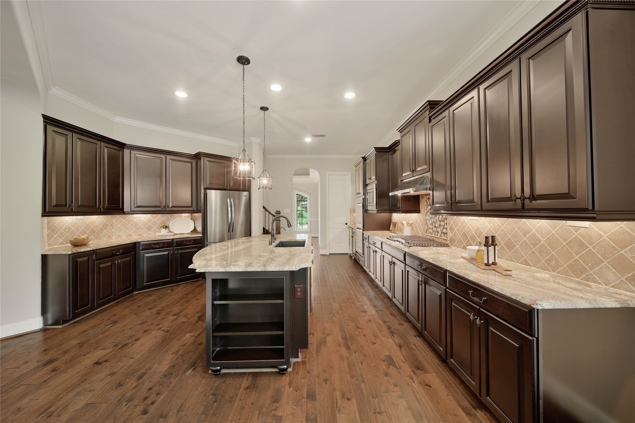 A gourmet kitchen every chef will love, featuring exceptional finishes, abundant workspace, and premium amenities. Enjoy the convenience of pull-out cabinet shelves, offering easy access and efficient use of every inch of storage space.