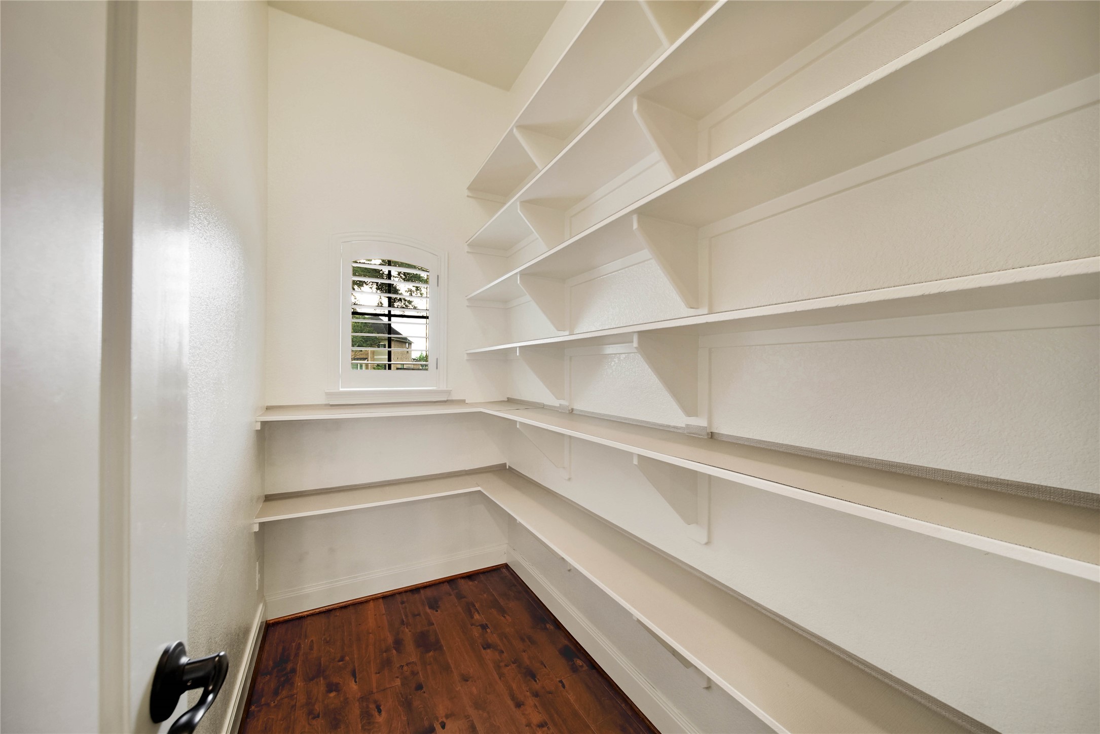 A true standout feature, the oversized walk-in pantry provides exceptional storage and convenience for the home chef and busy household.