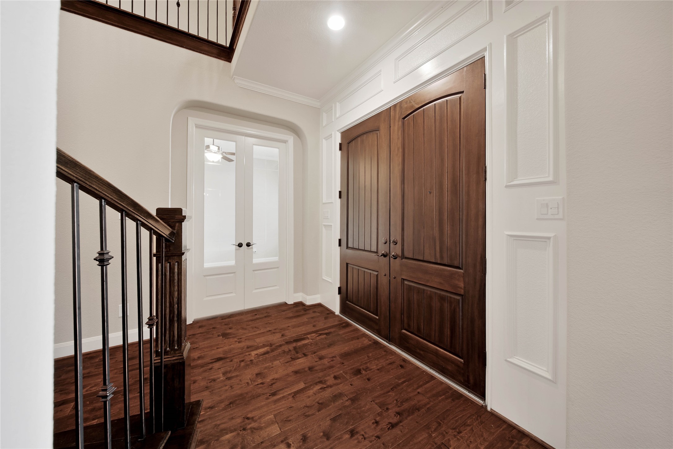 The grand entry, highlighted by soaring ceilings and rich wood floors, makes an unforgettable first impression. The grand entry, highlighted by soaring ceilings and rich wood floors, makes an unforgettable first impression.