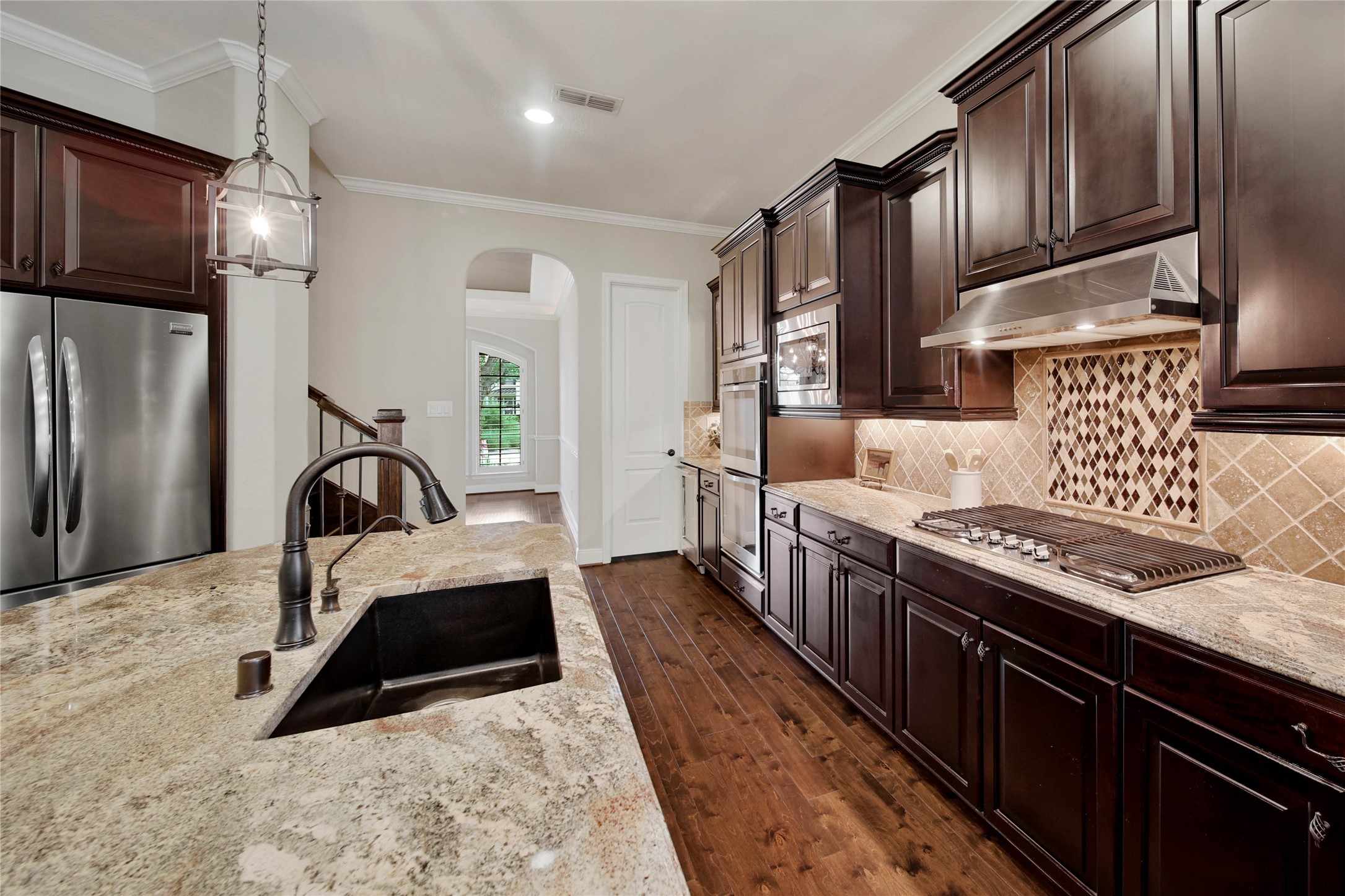 Enjoy plenty of workspace with stunning exotic granite countertops, complemented by under-cabinet lighting that highlights the craftsmanship and creates the perfect ambiance.