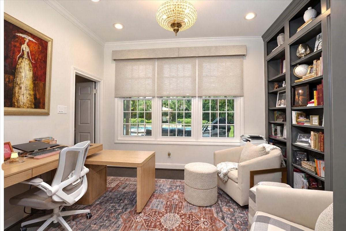 Pool views through the windows, custom built-ins for your books and keepsakes, and ceiling speakers for background music make this study as practical as it is elegant.