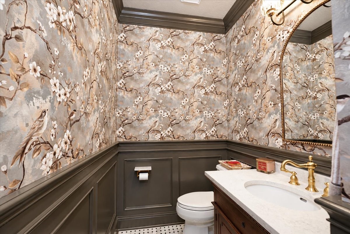 Details your guests will notice. This powder bath was fully updated in 2025 with marble tile, wallpaper, and painted enameled paneling, so a quick stop feels like a design moment.