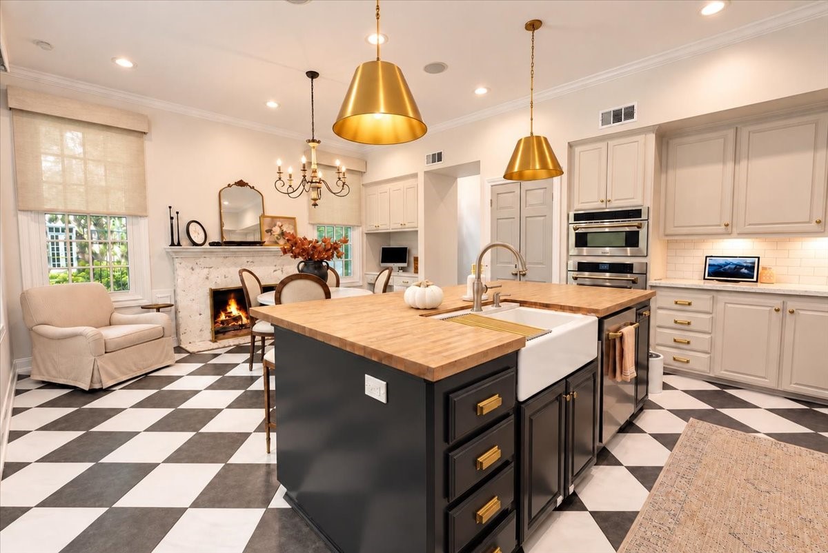 A fireplace in the kitchen sets this home apart! The gas-log fireplace, finished with custom German schmear, adds warmth and character to the breakfast area, perfect for cool mornings and relaxed weekend gatherings.