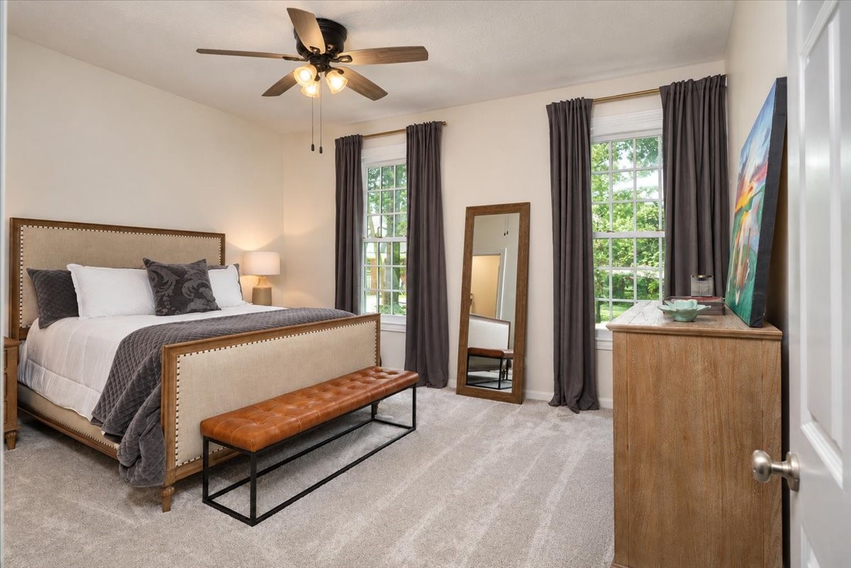 A generous second-floor bedroom with the extras you want. A walk-in closet, soft new carpeting, and a ceiling fan keep the room comfortable year-round.
