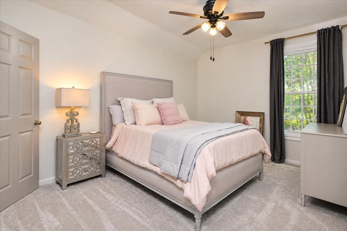Bright, quiet, and easy to enjoy. Tucked away upstairs, this bedroom has a walk-in closet and leafy window views, plus access to the special Christmas closet, a rare extra storage space for holiday dcor.
