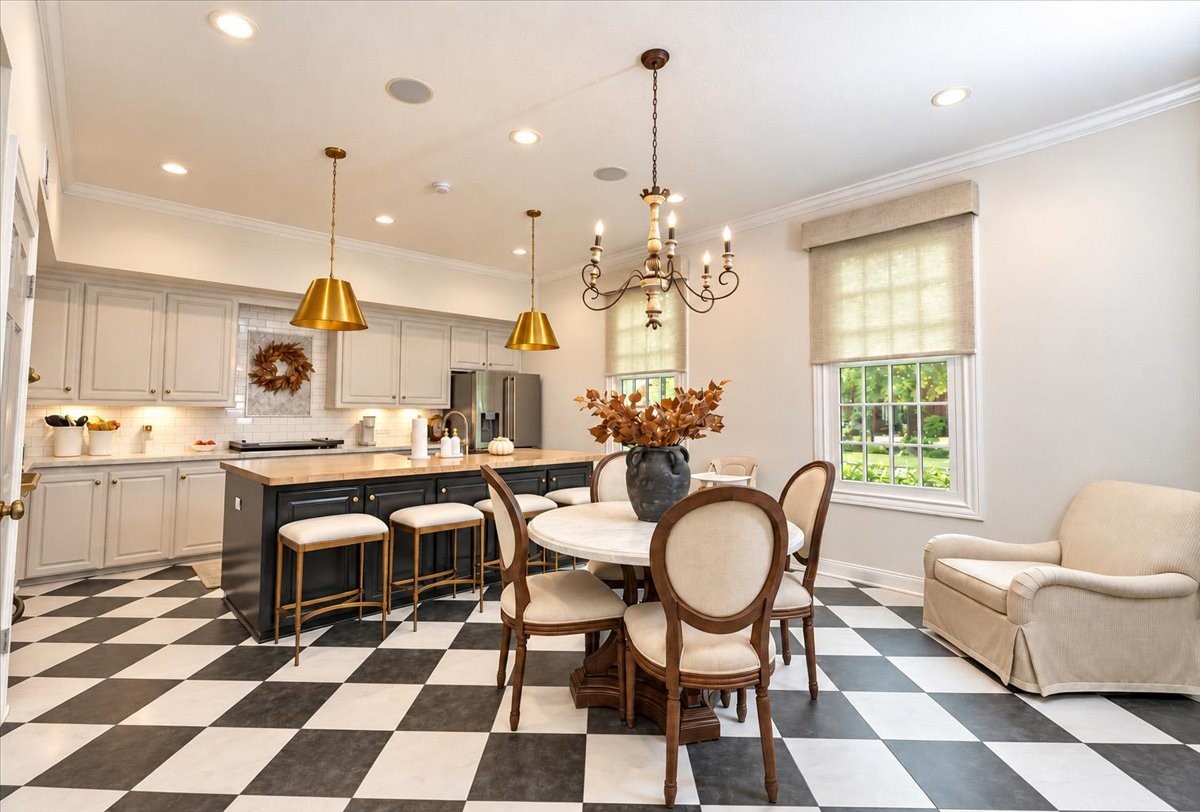 Built-in microwave and single oven, a subway tile backsplash, and ceiling speakers make everyday cooking and weekend hosting feel effortless, while automatic shades with remote adjust the light at the touch of a button.