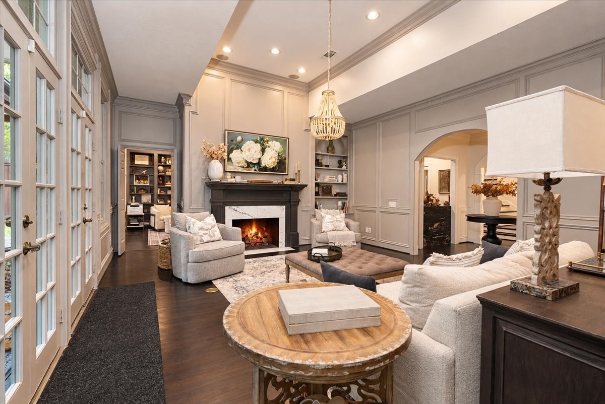 Dark hardwood floors and a beaded chandelier add warmth and a touch of luxury to every gathering.