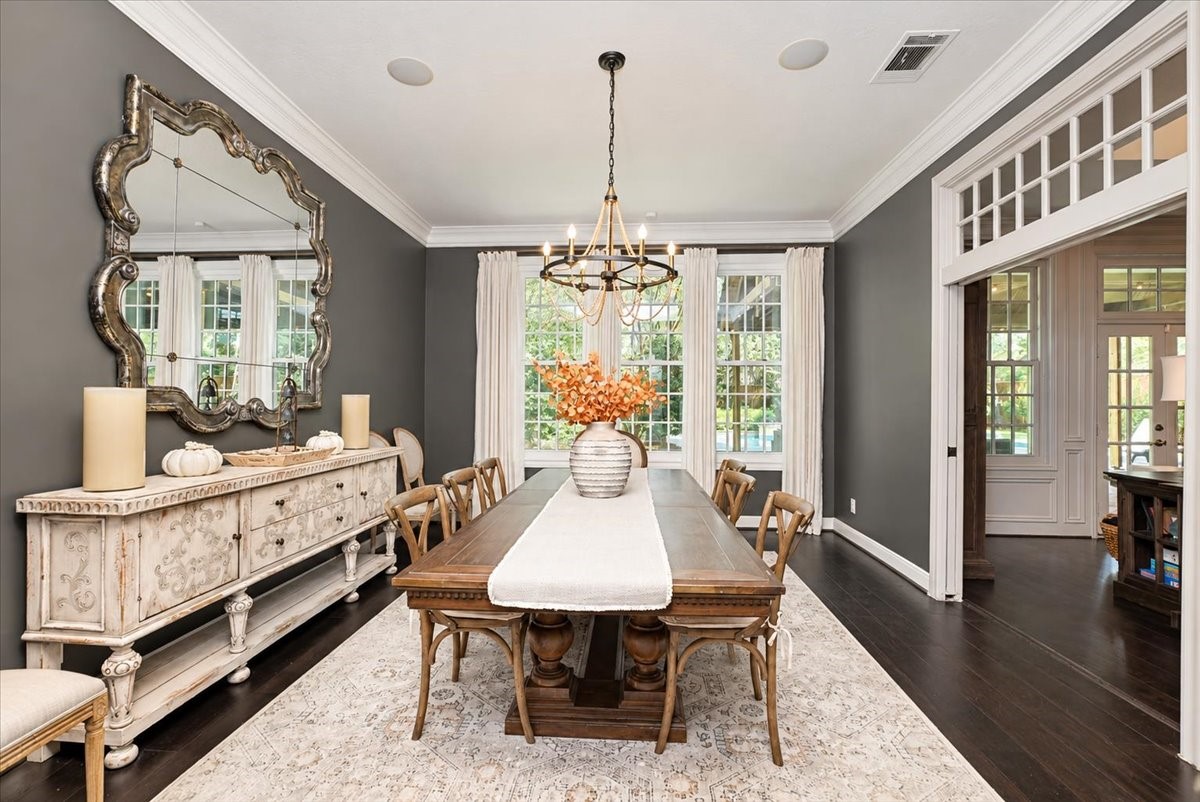 Custom French pocket doors open to the living room, so you can host a crowd of 12 at the table and let the party flow, with ceiling speakers and dimmer switches to set the mood.