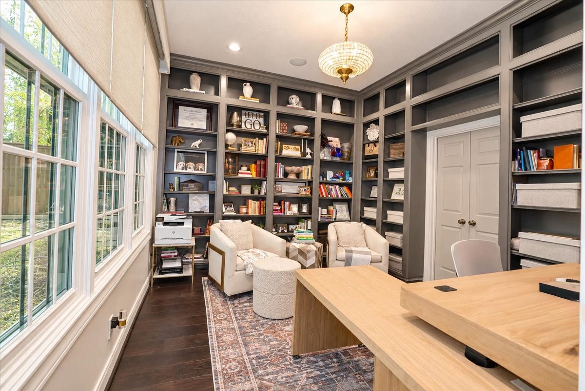 Room for every book and keepsake! Floor-to-ceiling enameled built-ins wraps this elegant study, with double doors that open directly to the primary bedroom.