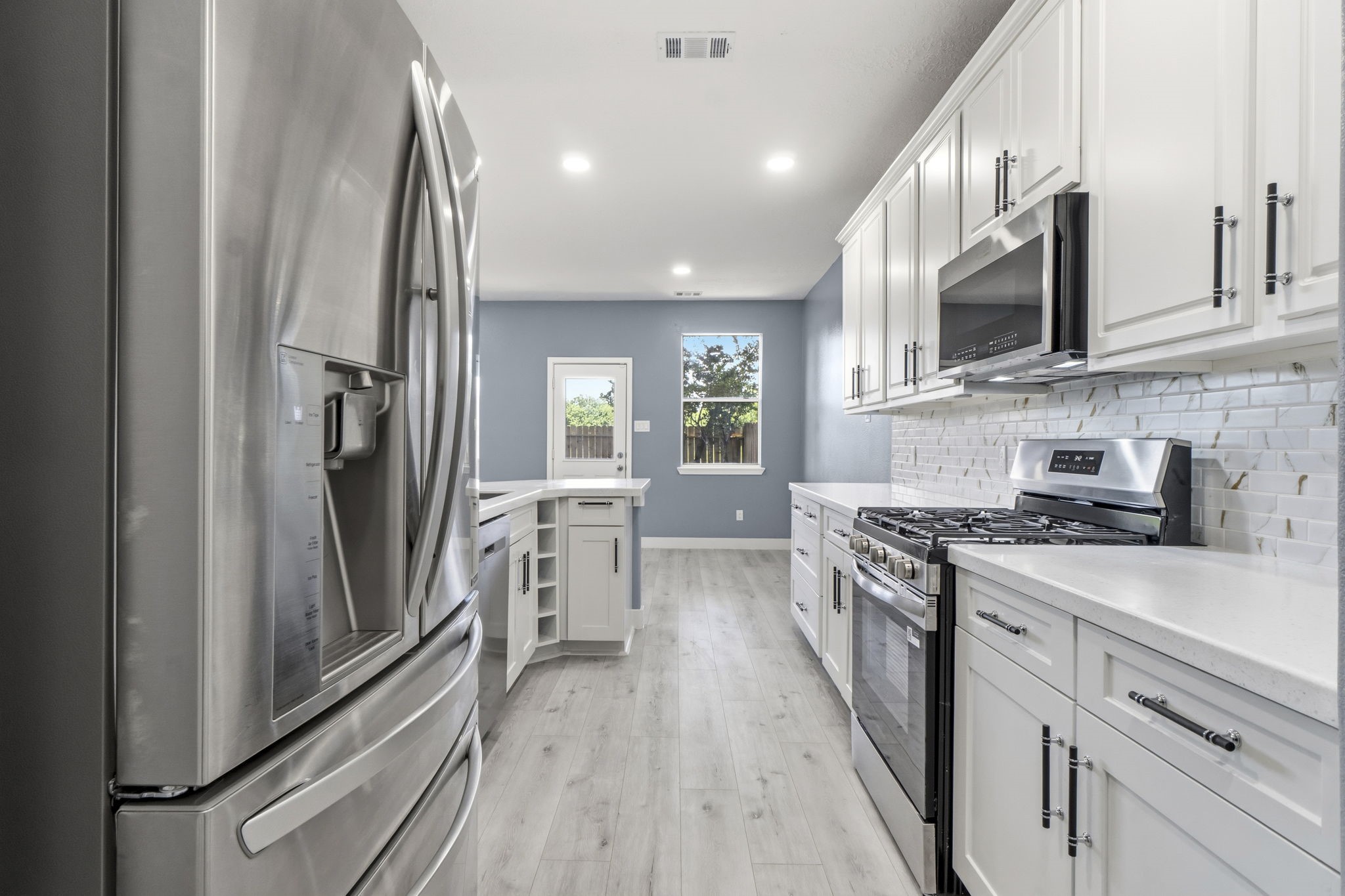 Stainless steel appliances. Gas Range/oven. Refrigerator stays.