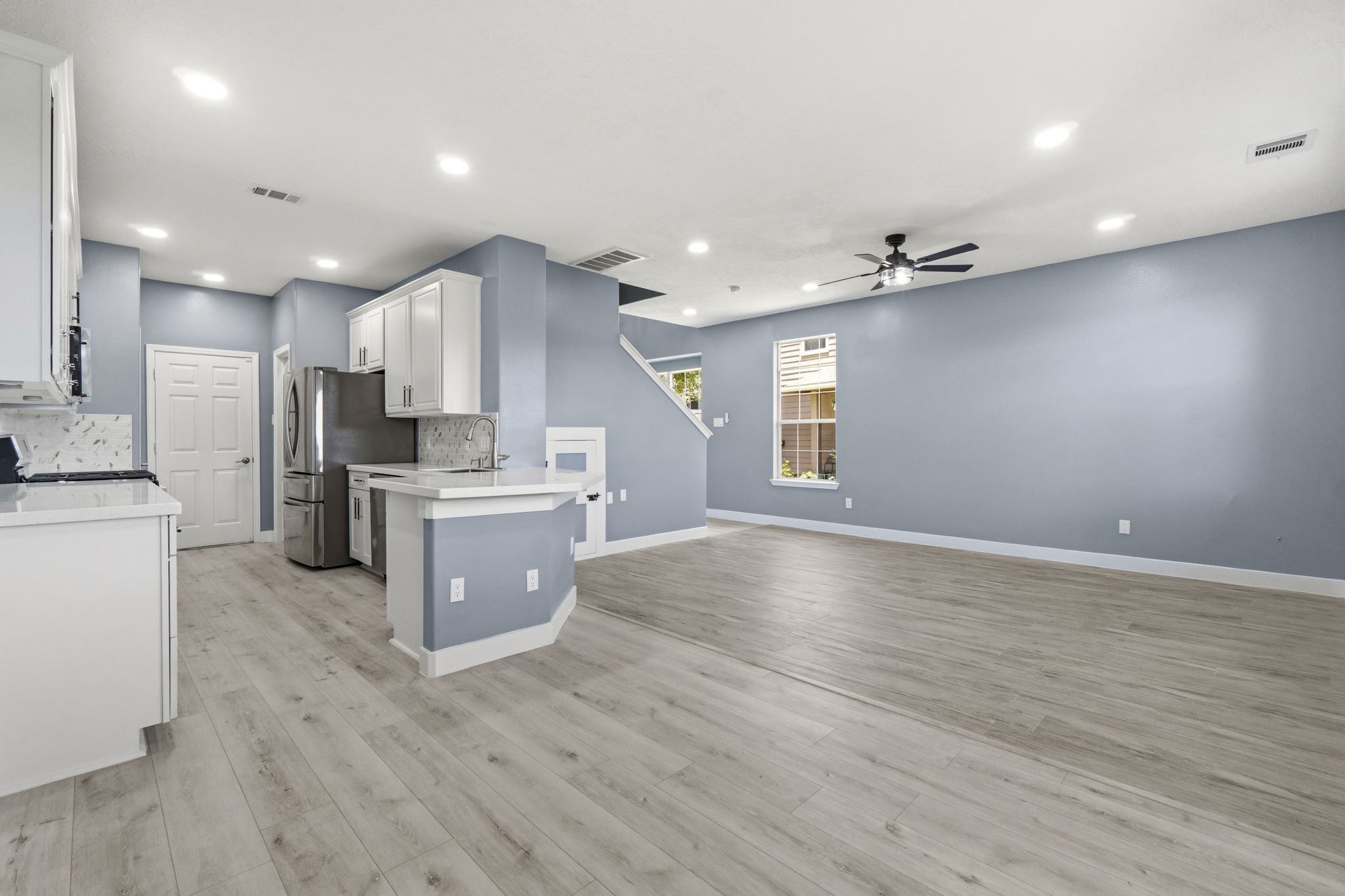 Recessed lighting provides a bright,  modern ambiance