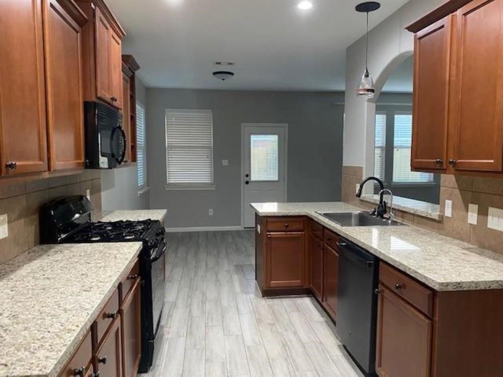 Kitchen area with a refrigerator