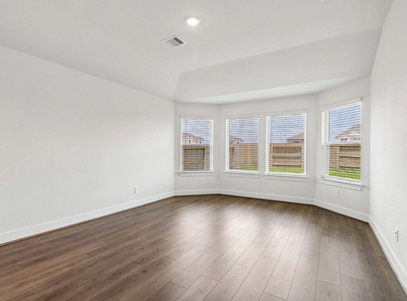 Primary bedroom with no carpet