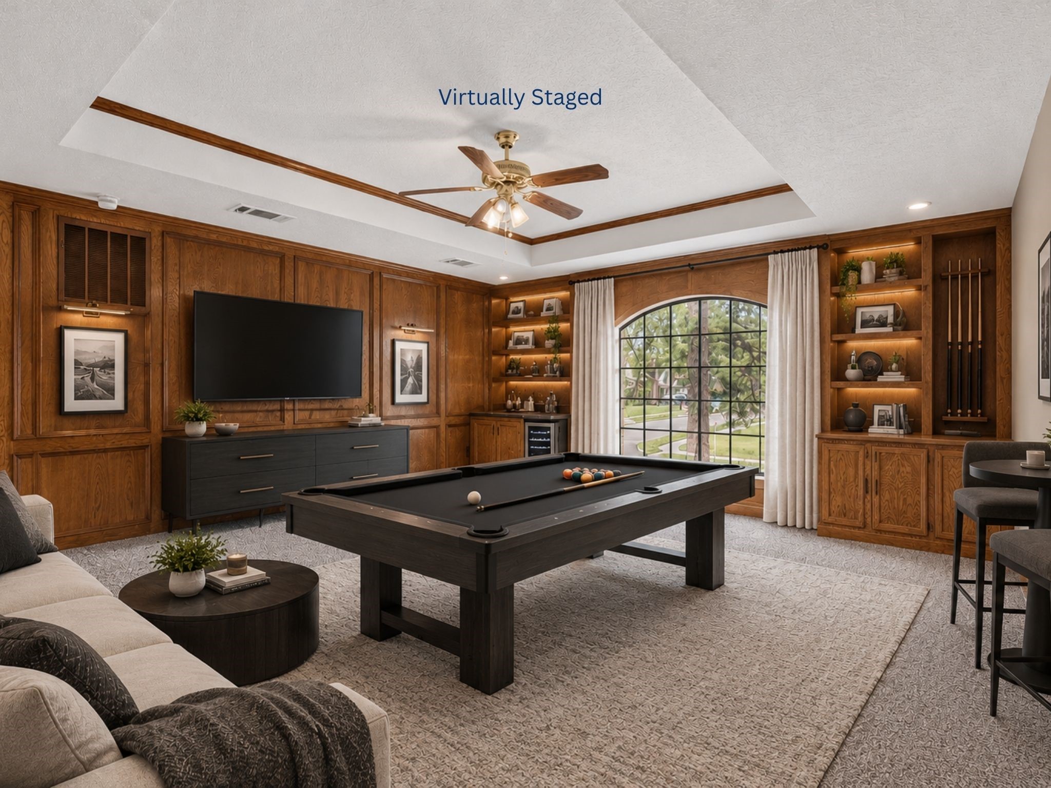 Virtual staging demonstrates the versatility of this spacious room, giving buyers a glimpse of how it could become a game room, media space, hobby area, or gathering place for family and friends.