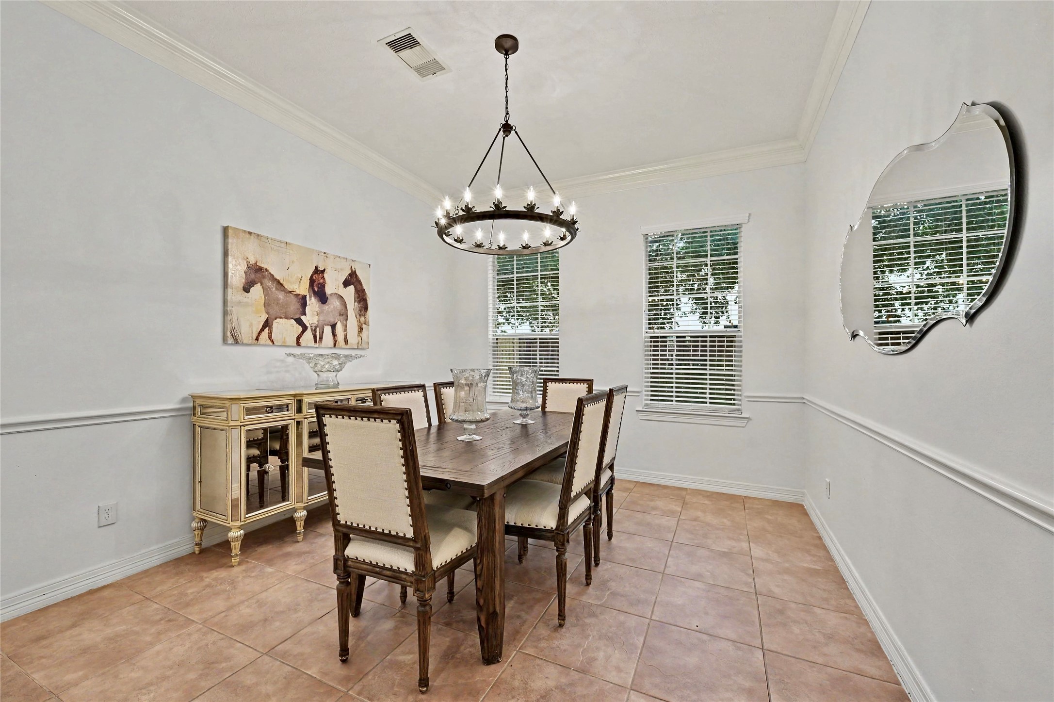 Bright formal dining area with tile flooring and an inviting, open feel.
