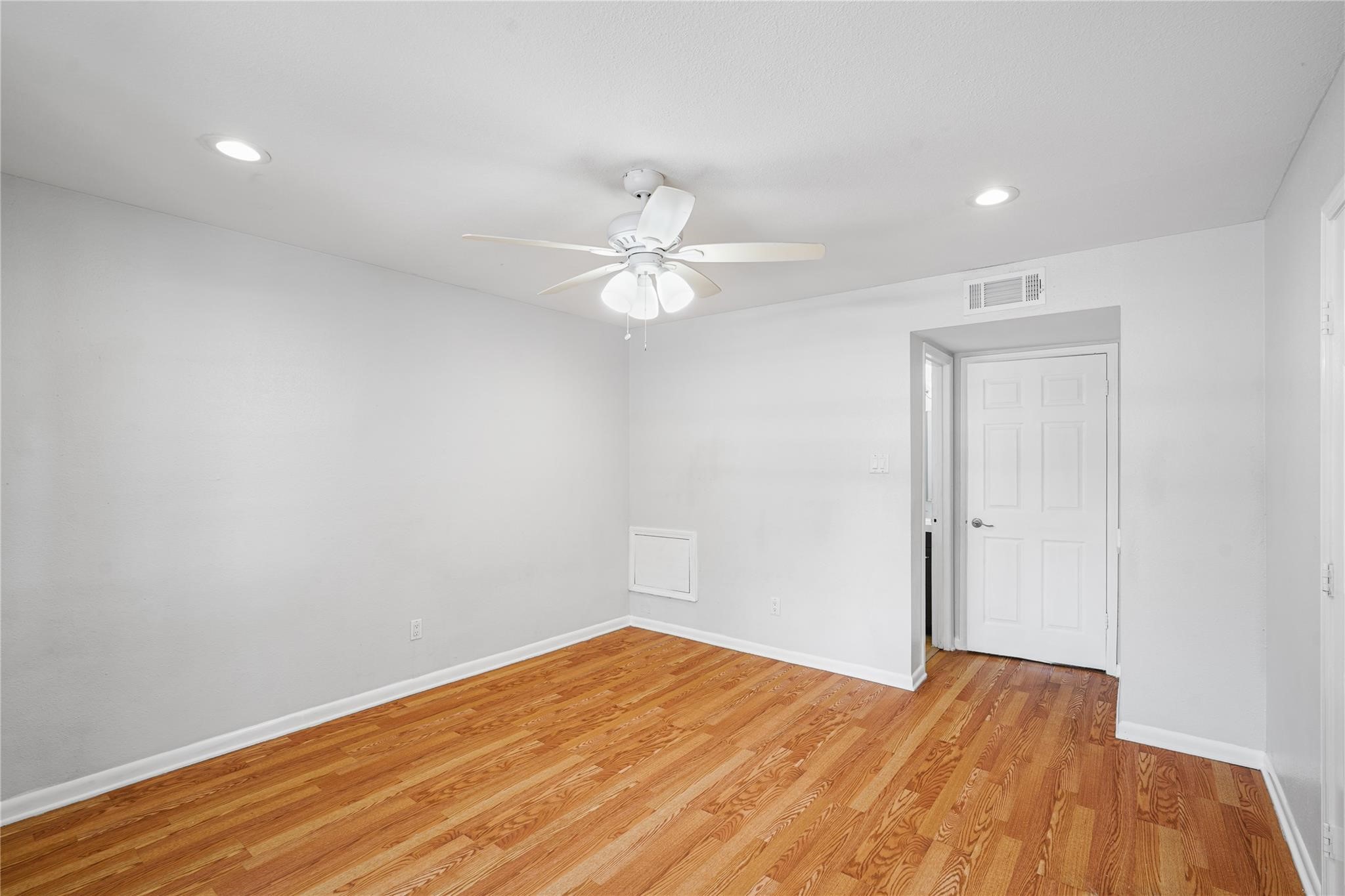 Another view of the primary bedroom.