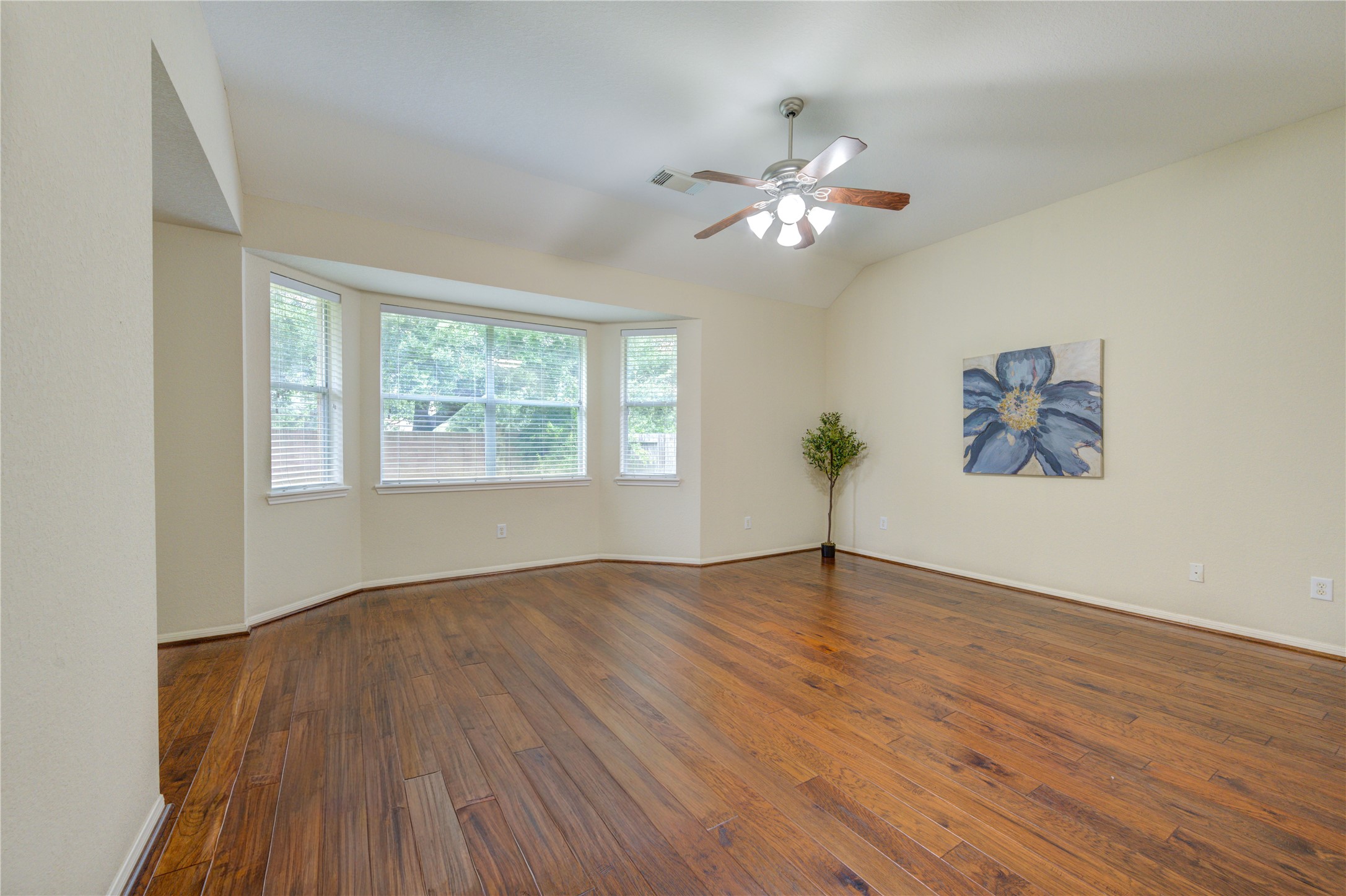 Private owners retreat featuring vaulted ceilings, and oversized windows that create a bright and comfortable atmosphere.