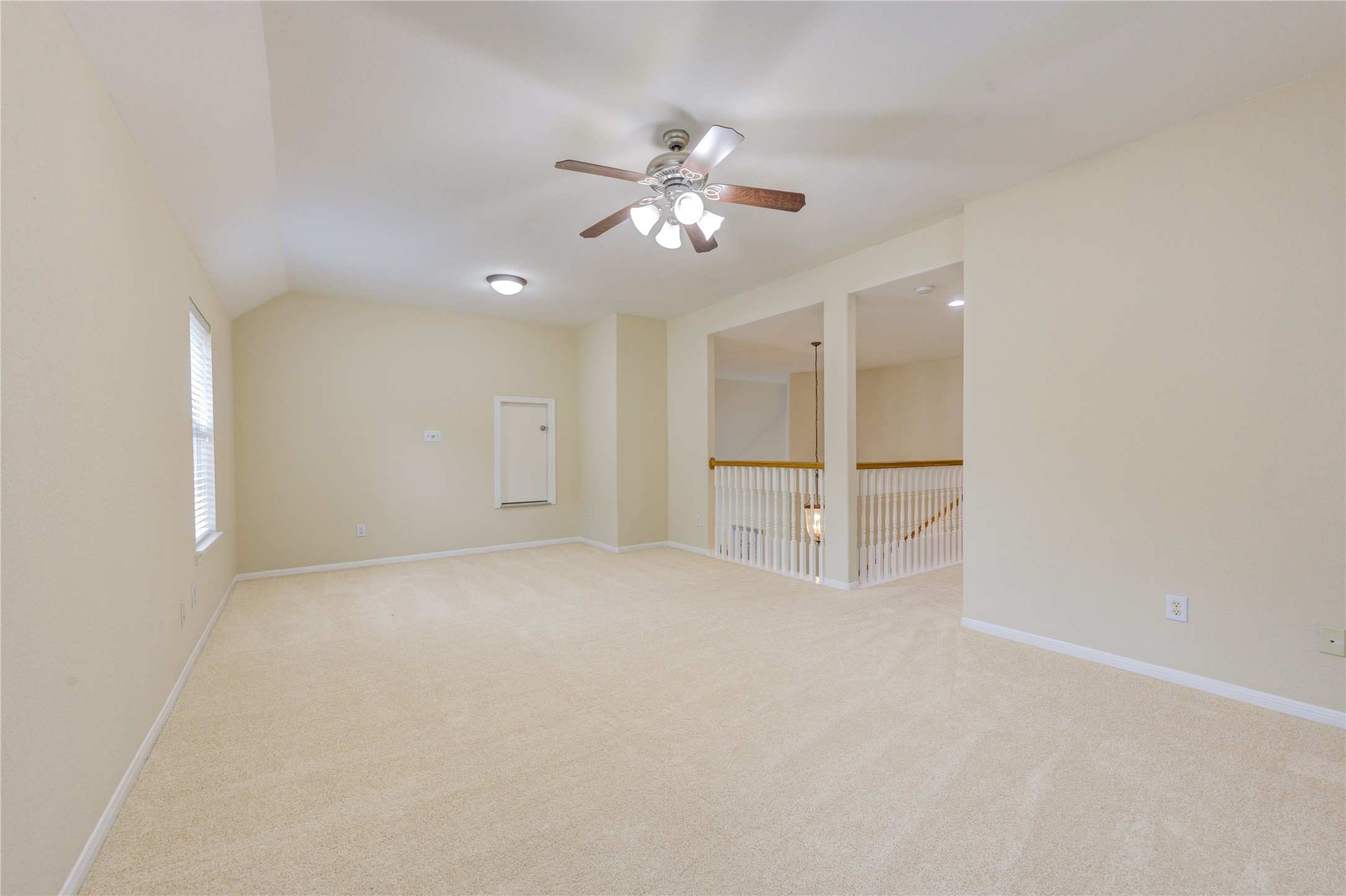 Expansive game room offering flexible space for movie nights, playroom setup, or entertaining guests.