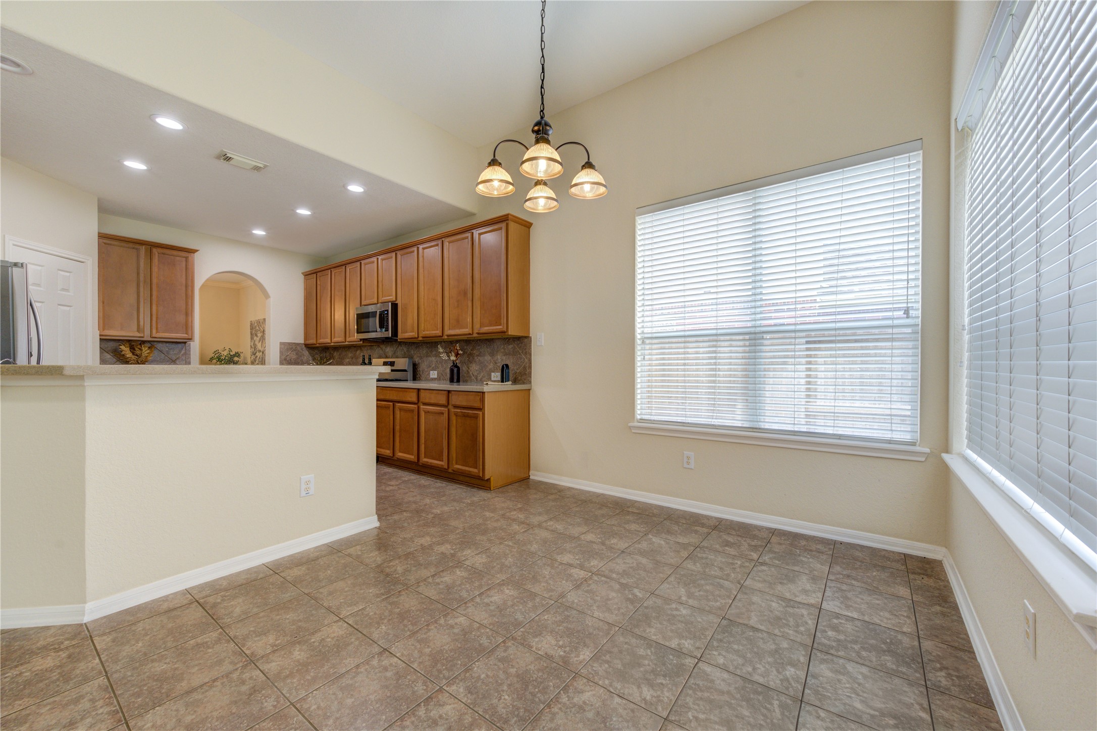 Sunny breakfast area with an open view into the inviting family room.