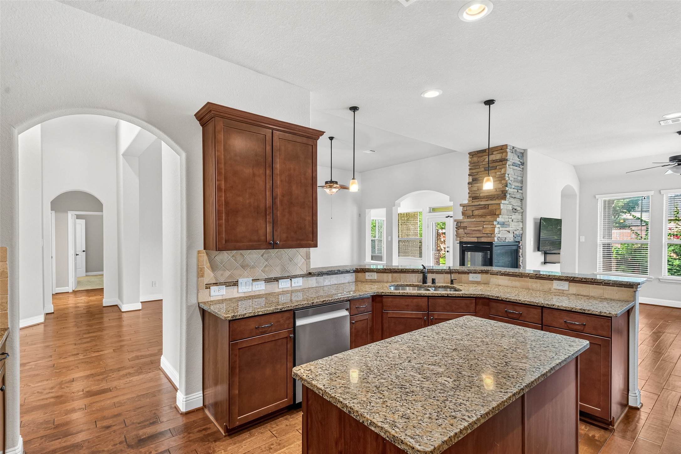 Granite countertops and an island provide extra workspace.