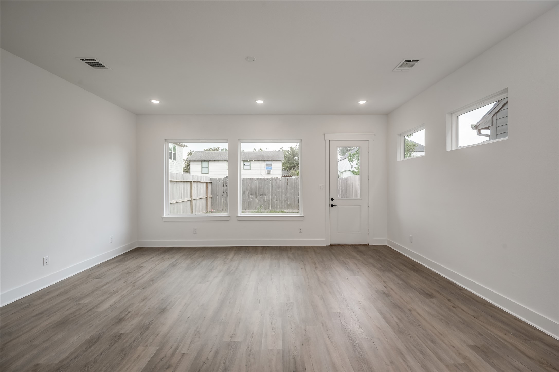 Sunlight pours into the living room through the front windows, creating a warm spot to unwind