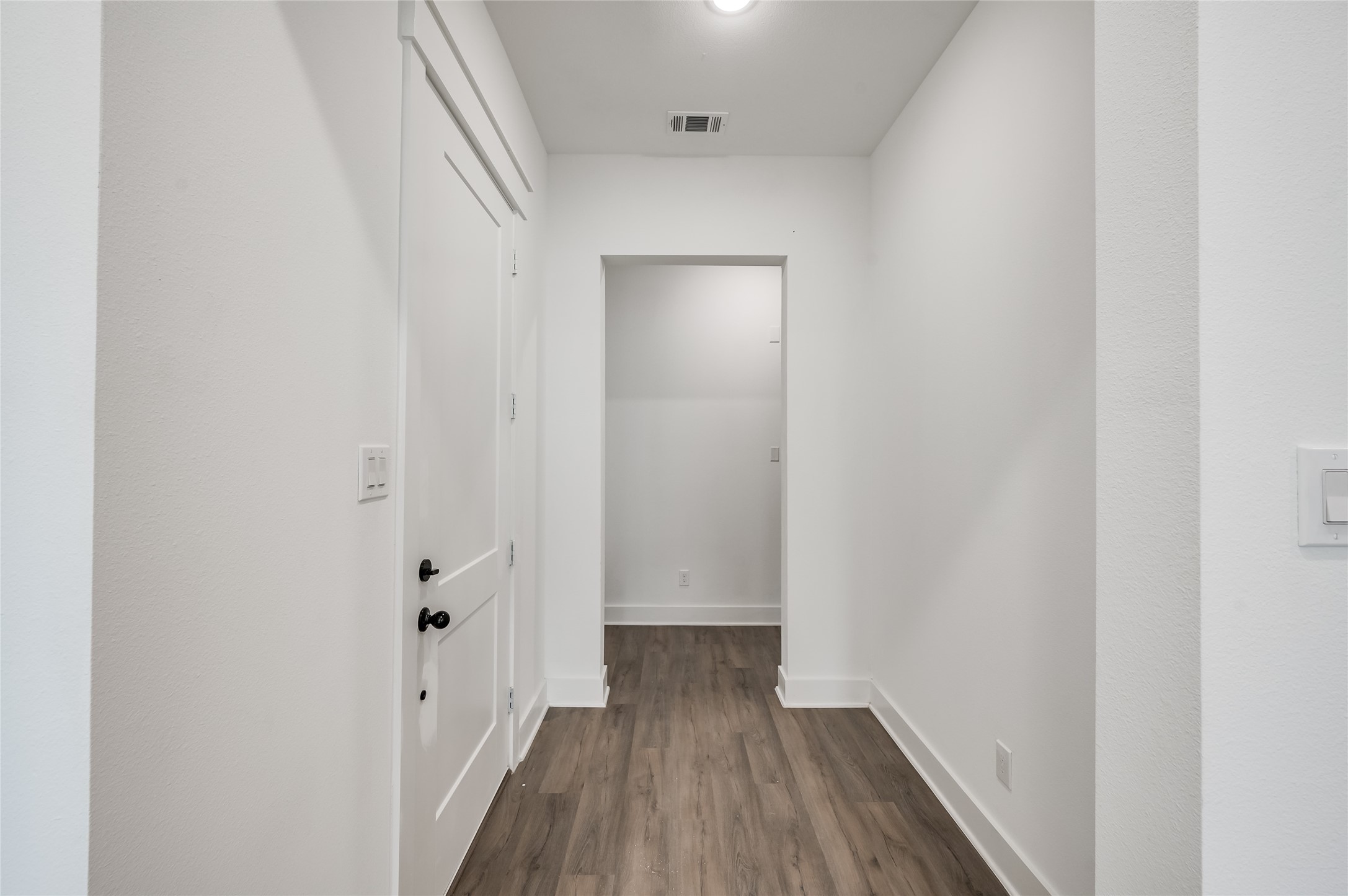 Just inside, a welcoming entry sets the tone for the easy flow of the home ahead