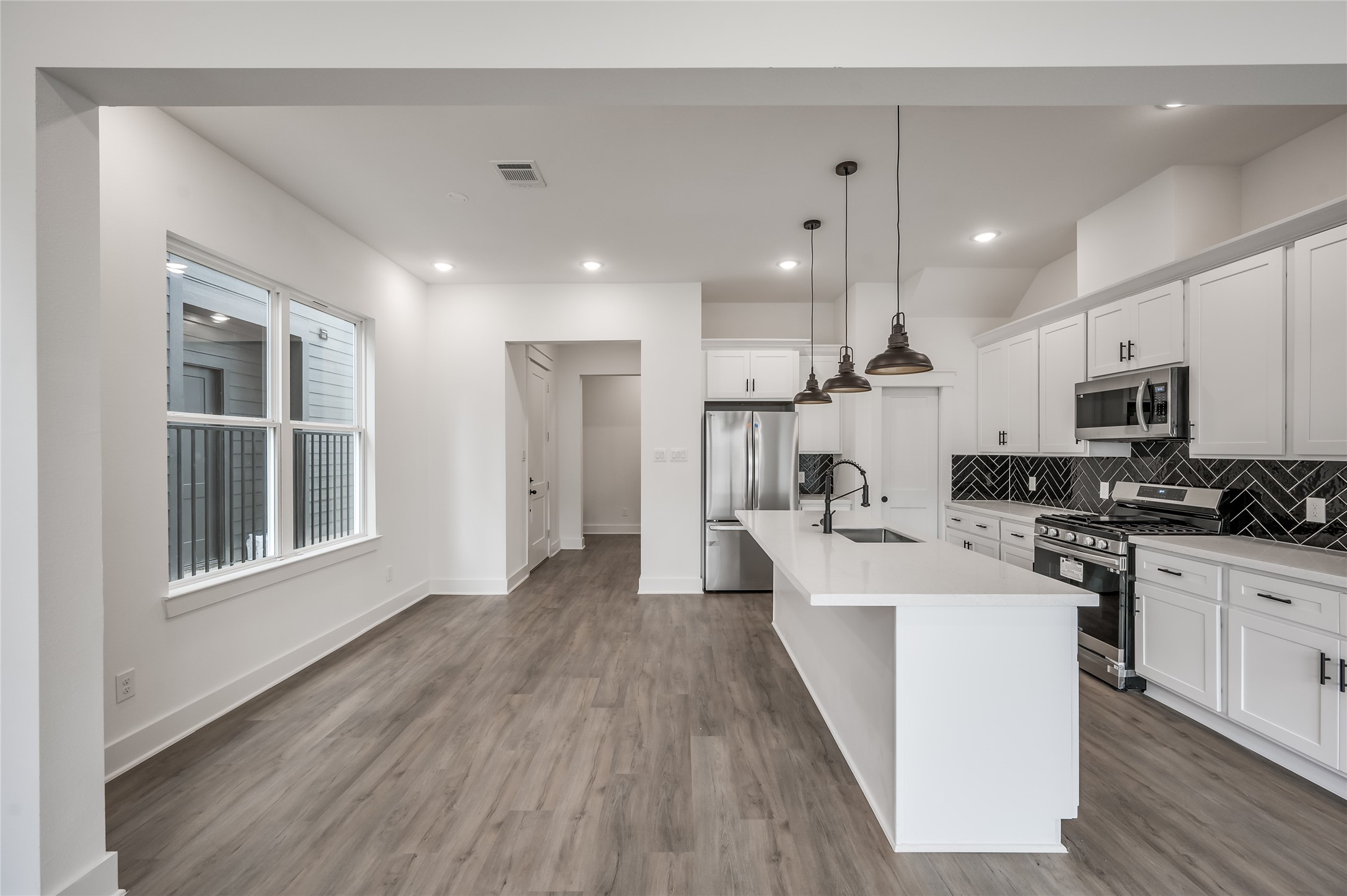 The kitchen opens right into the dining area, keeping the whole first floor connected and easy to entertain in