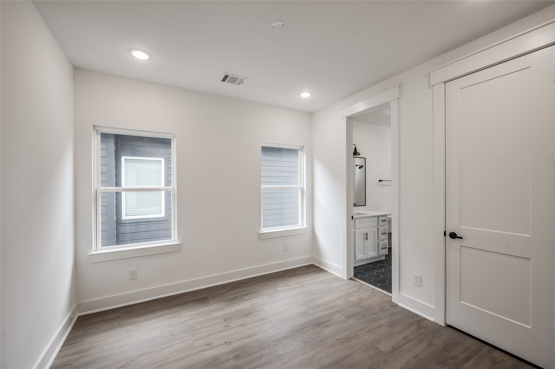 A second upstairs bedroom brings flexibility, perfect for guests, family, or a home office