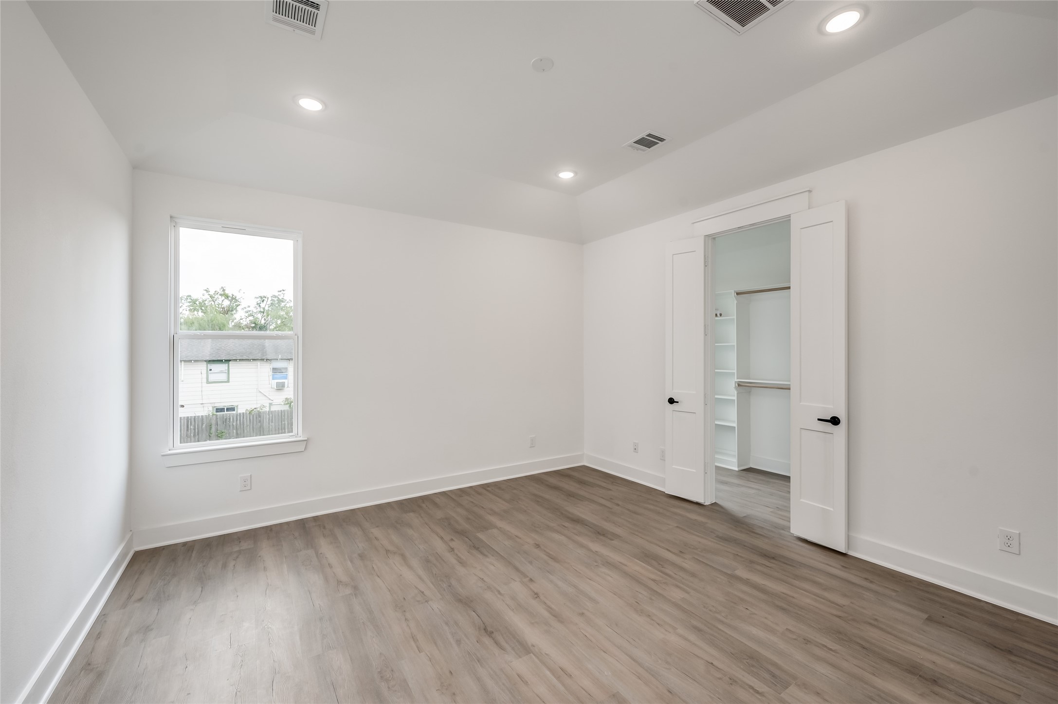 The primary bedroom offers a quiet retreat upstairs, roomy enough to fully unwind at the end of the day