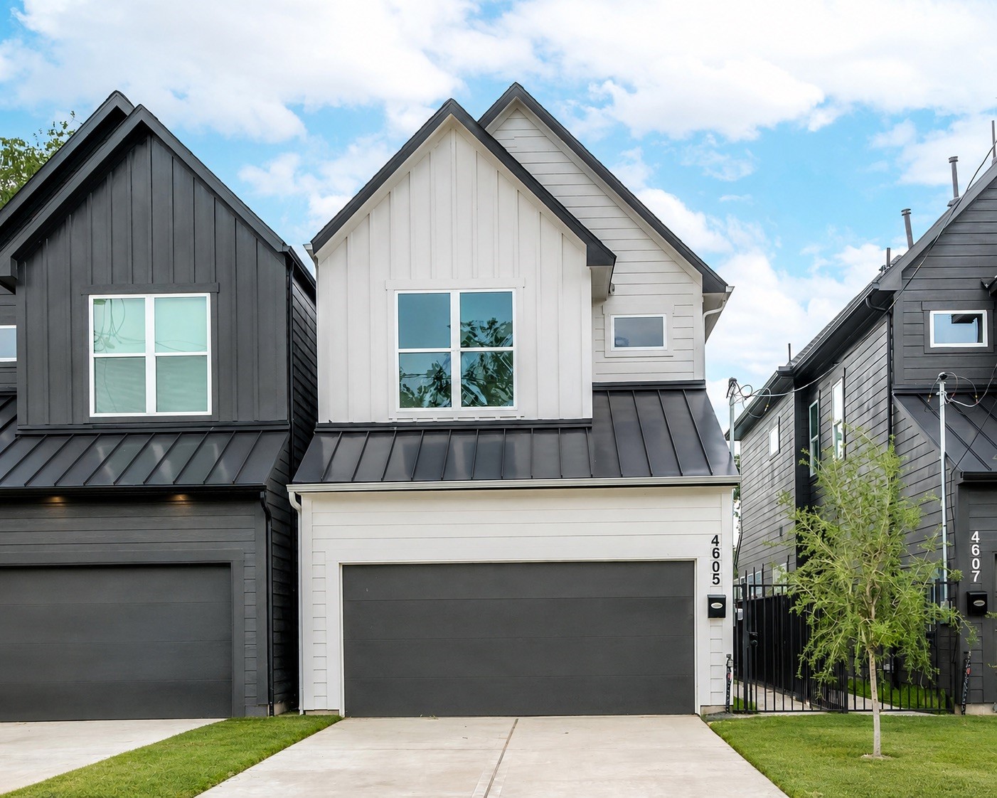 A charming curb appeal welcomes you home, with striking dark and white exteriors and a two car garage ready for you to pull in and settle down