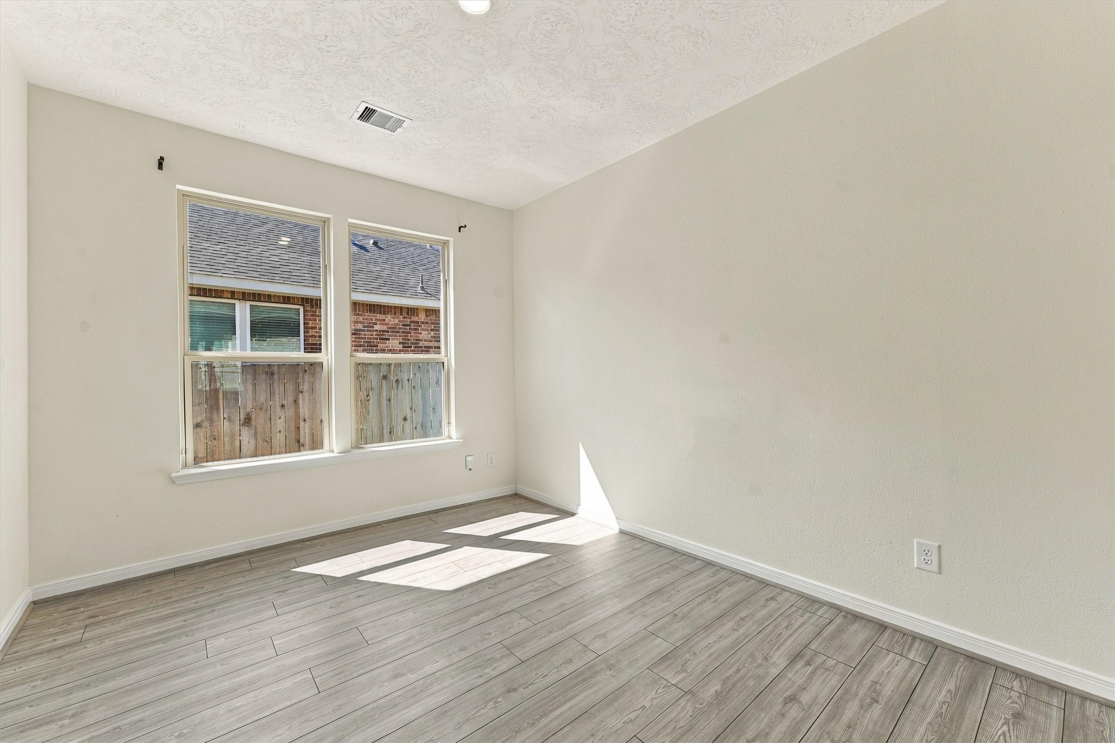 Home office with tons of natural light and french doors.