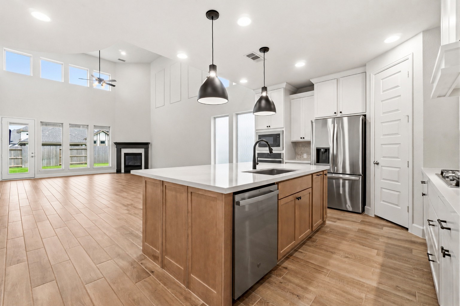 The thoughtfully designed open-concept plan seamlessly connects the kitchen, dining area, and family room, creating the perfect space for everyday living and entertaining.