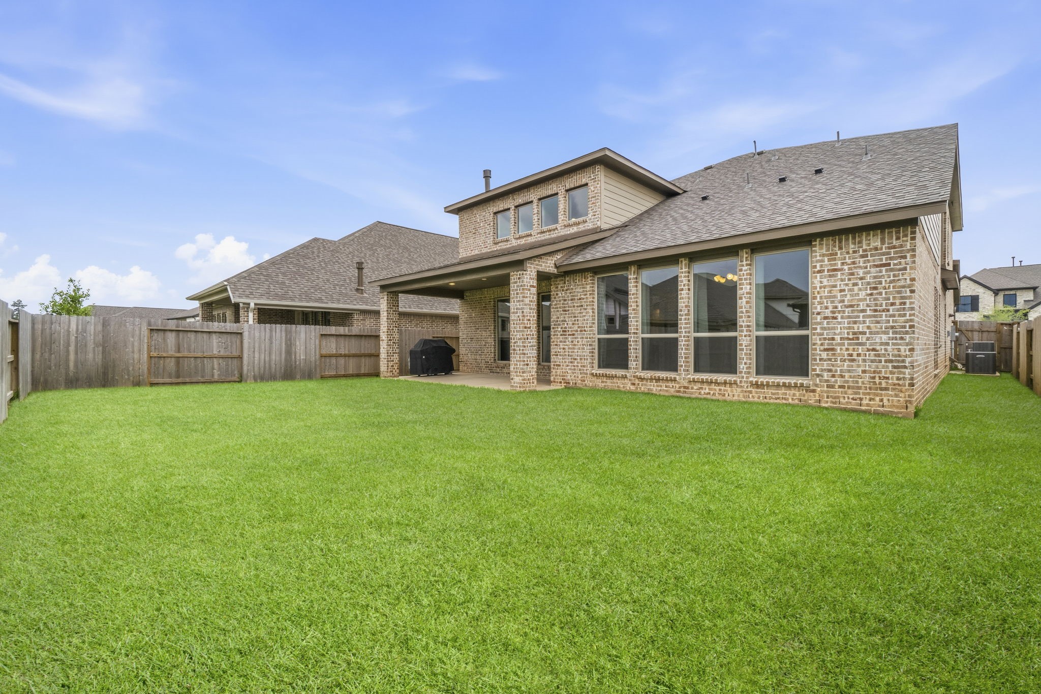 The spacious, fully fenced backyard offers plenty of room for outdoor entertaining, play, pets, or even a future pool. *VIRTUALLY ENHANCED