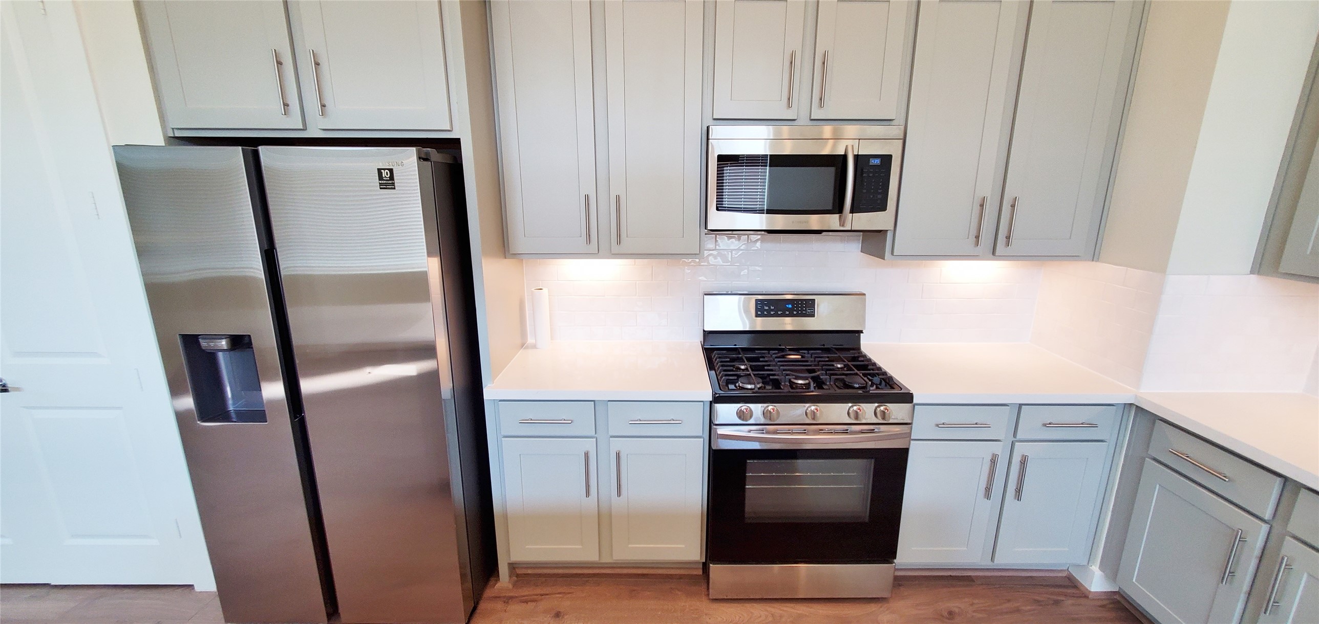 Large kitchen with island overlooking family room and dining area.  Refrigerator included