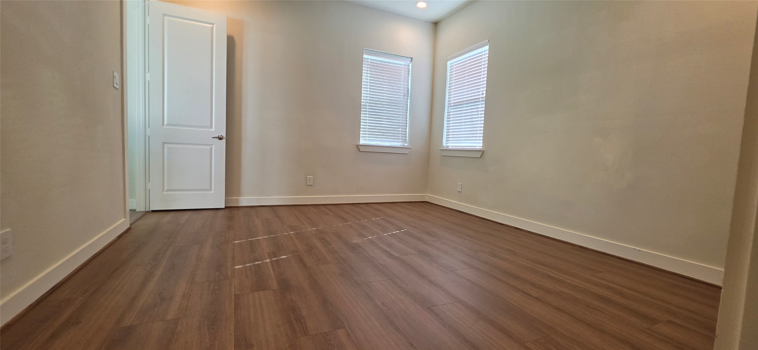 Primarey bedroom with laminate floors