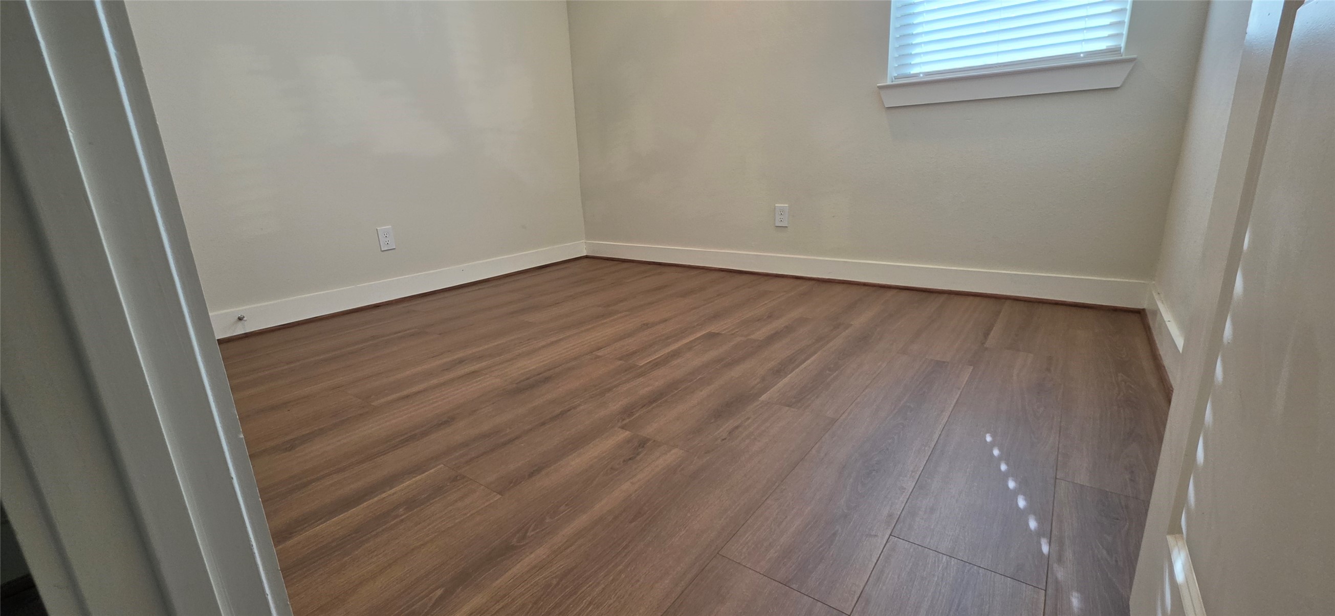 Secondary Bedroom with laminate floors